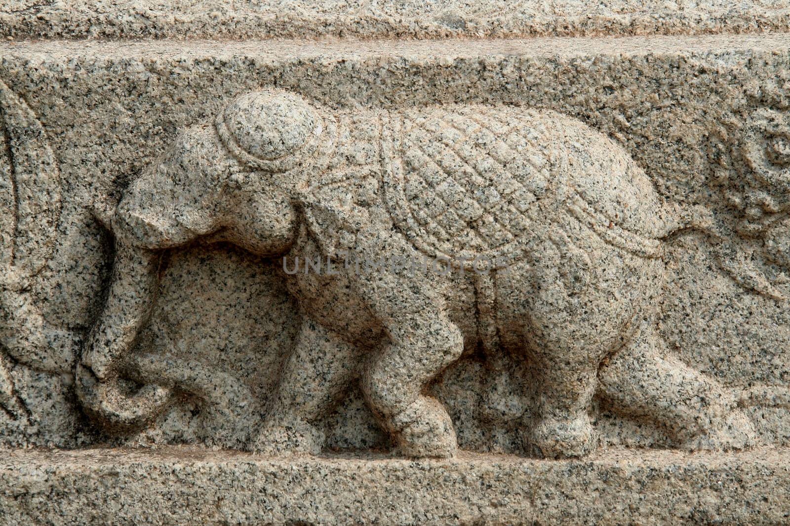 Sculpture of lively action of running elephant on the wall of Mahanavami Dibba at Hampi, Karnataka, India, Asia