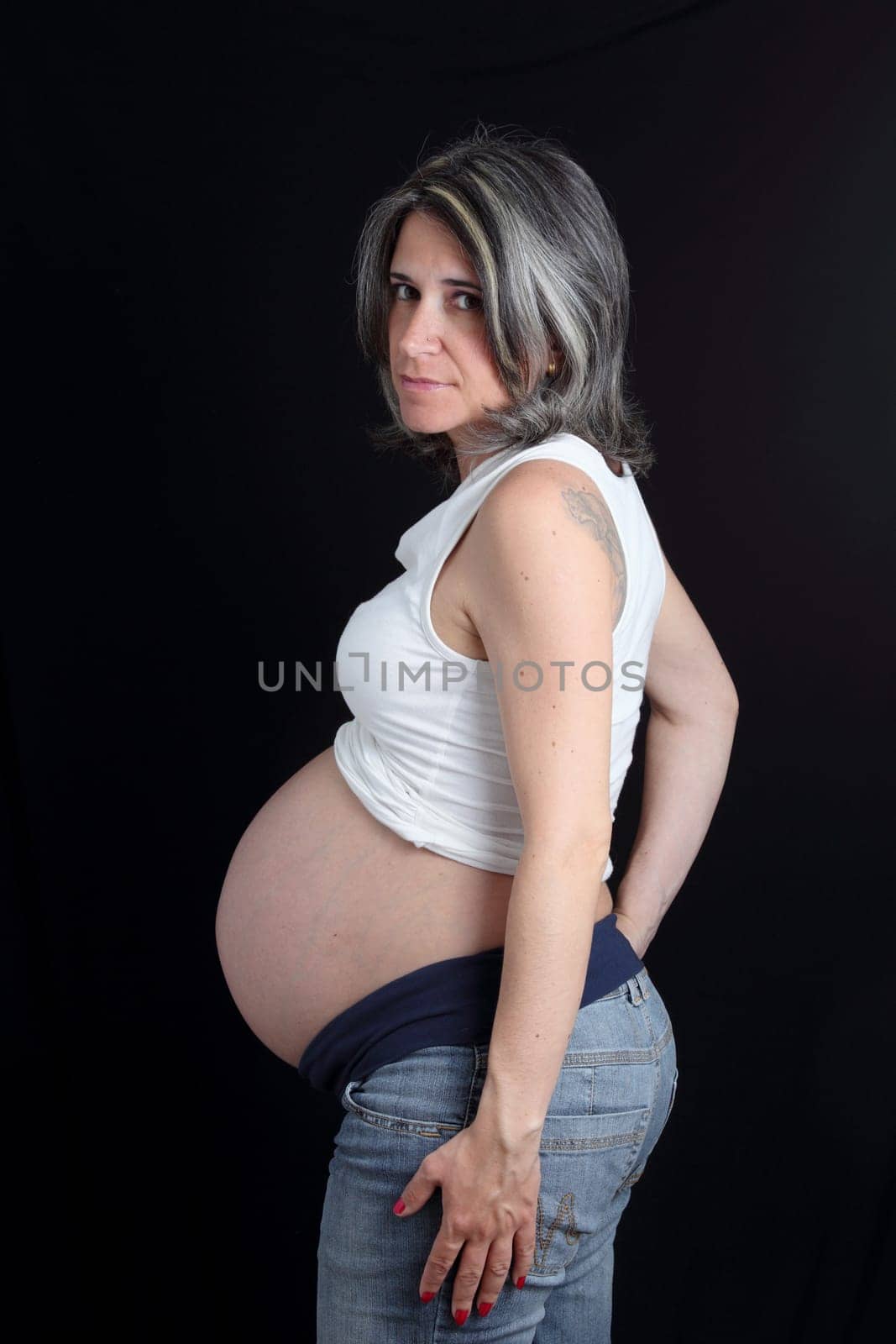 details of side view of a belly of pregnant woman