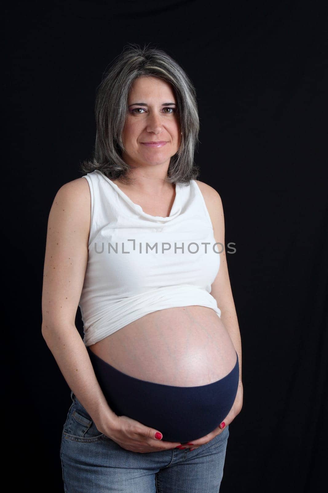 details of side view of a belly of pregnant woman