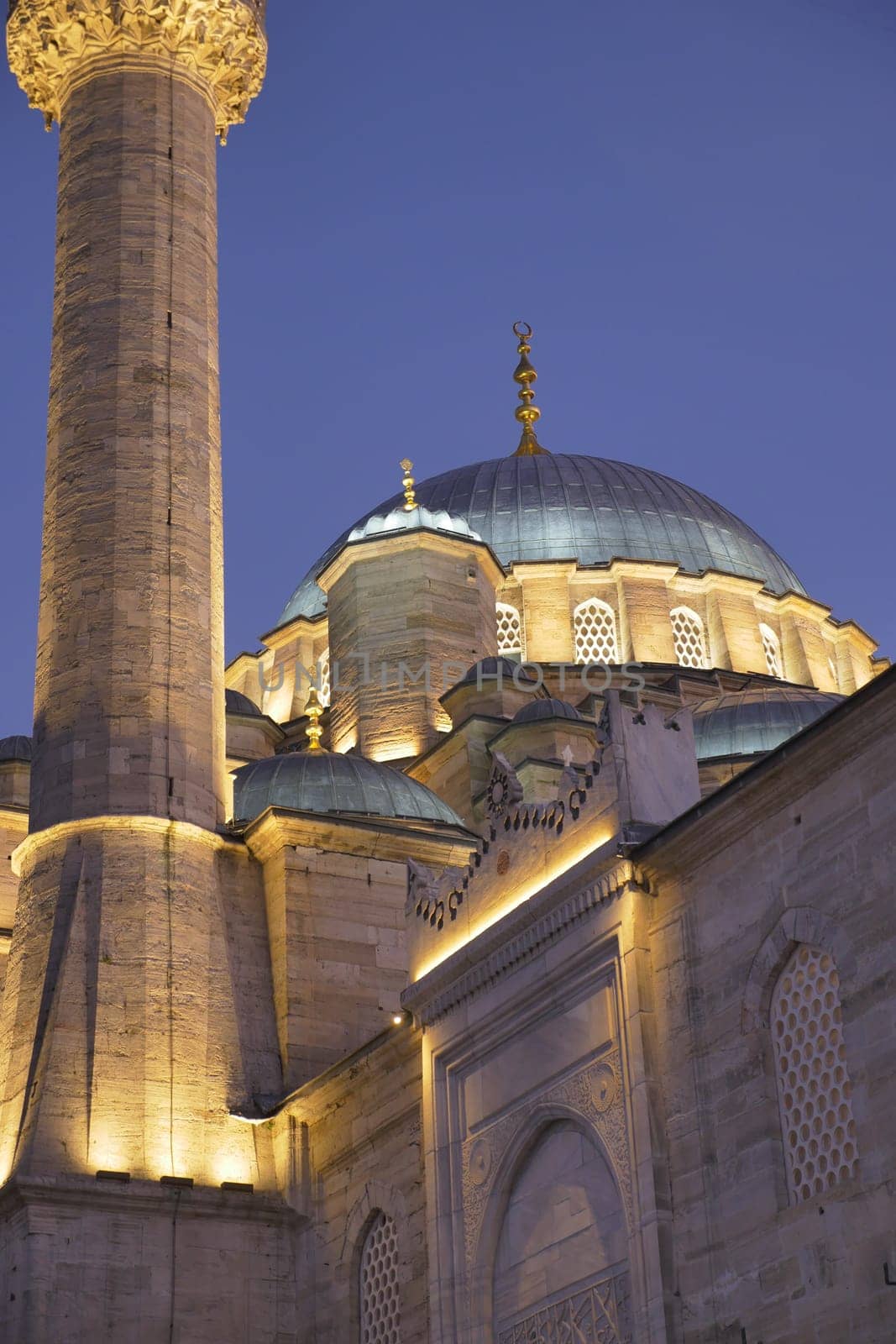 Fatih Mosque with lantern light at night .