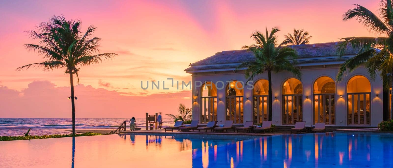 sunset at a swimming pool during a vacation on a tropical island, sunset tropical beach by fokkebok