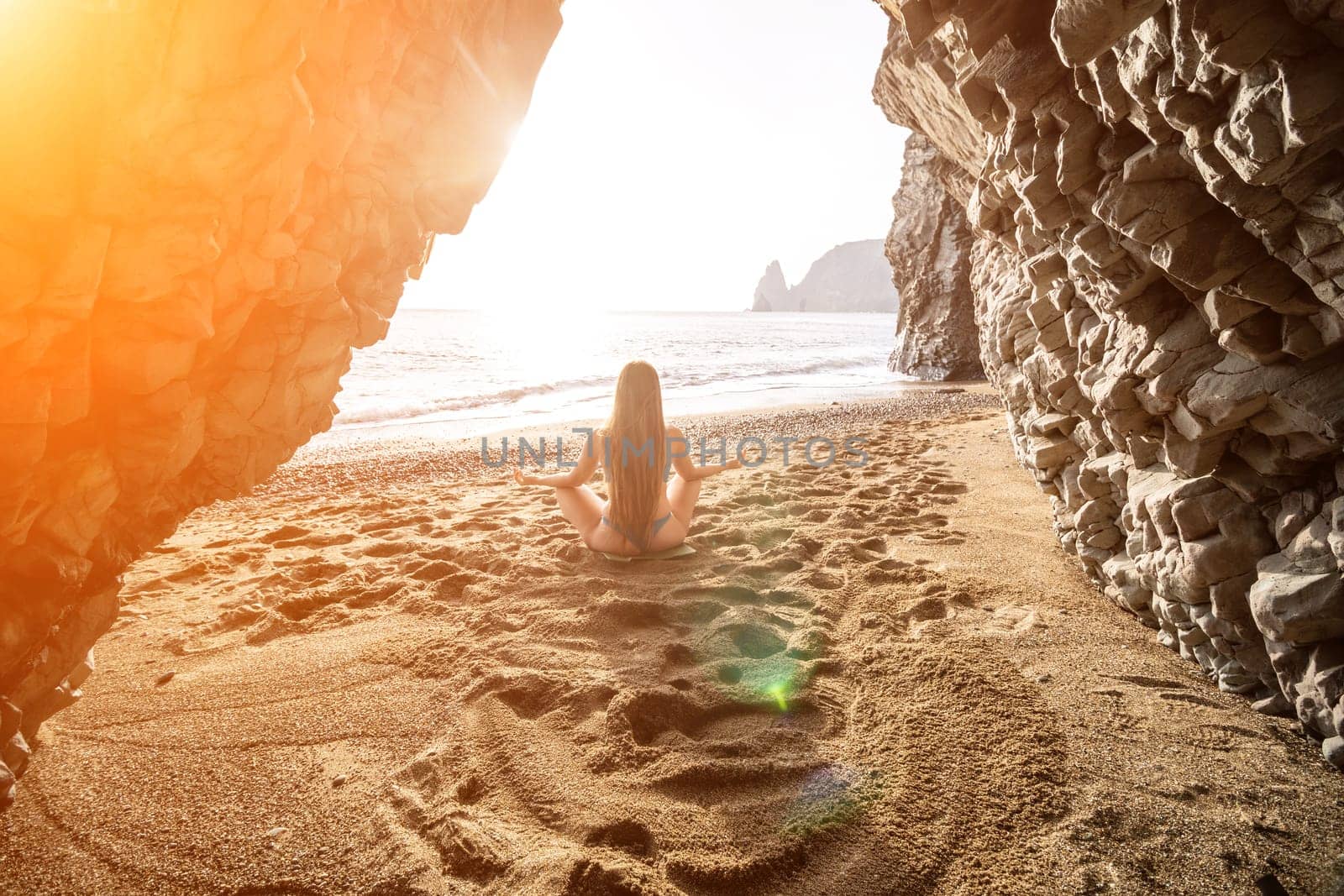 Woman sea pilates. Sporty happy middle aged woman practicing fitness on beach near sea, smiling active female training on yoga mat outside, enjoying healthy lifestyle, harmony and meditation. by panophotograph