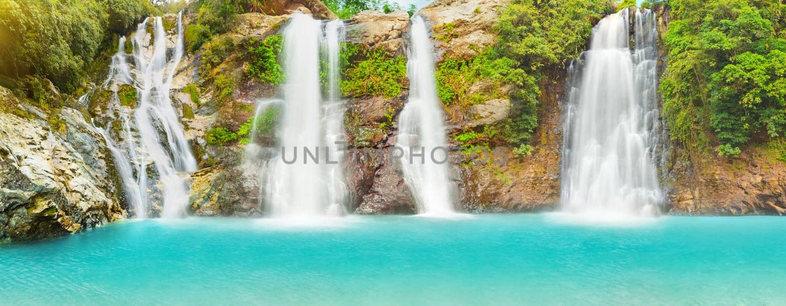 Beautiful panorama of waterfalls at summer day
