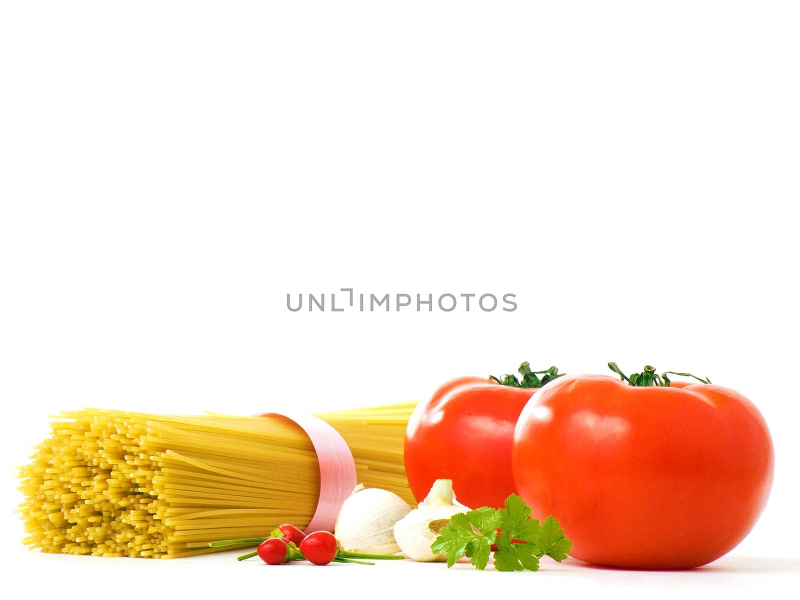 Materially for spaghettis, tomatoes, peppers, garlic, parsley, over a white background