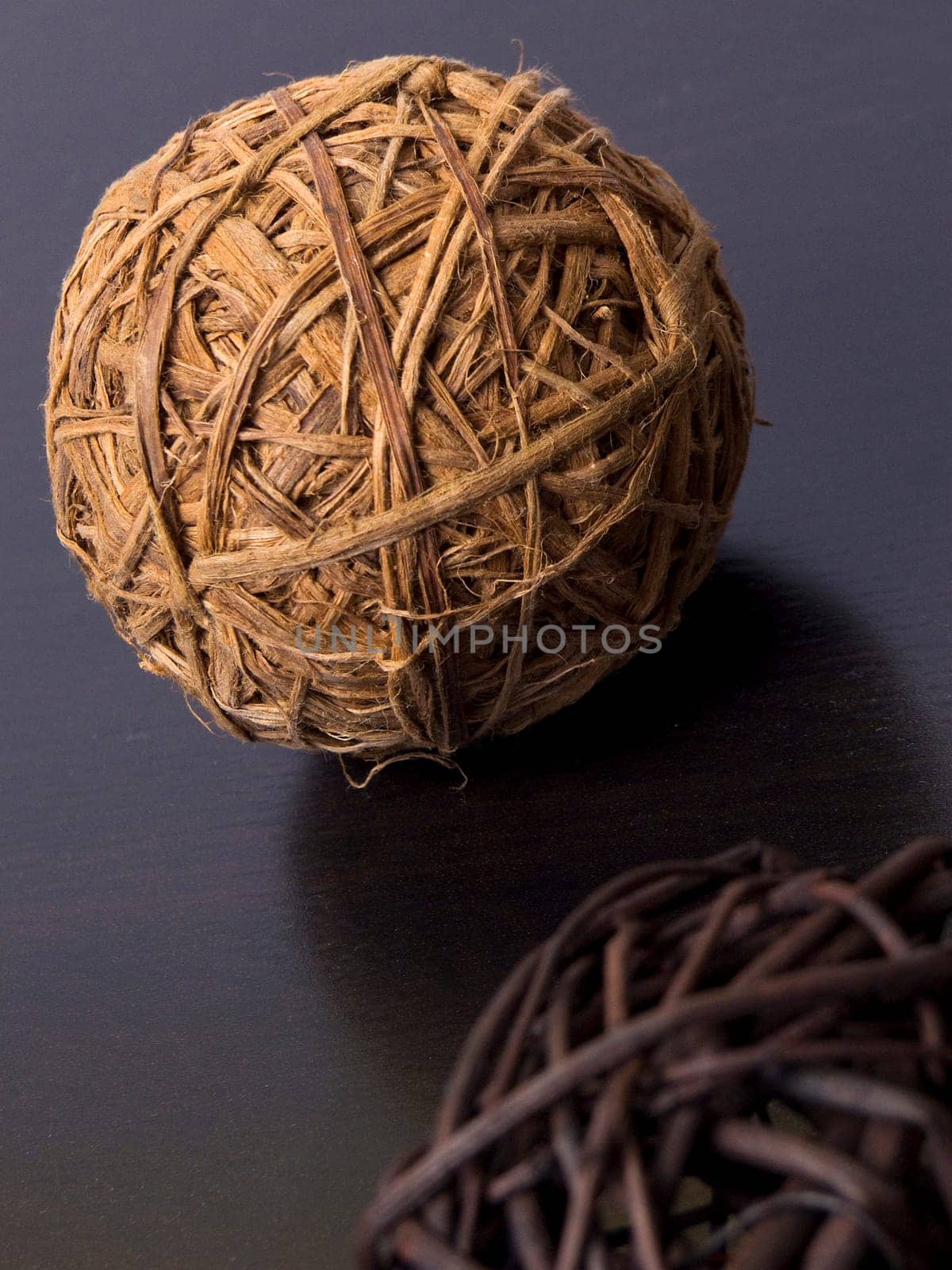 Home decoration light brown straw ball on a wooden table