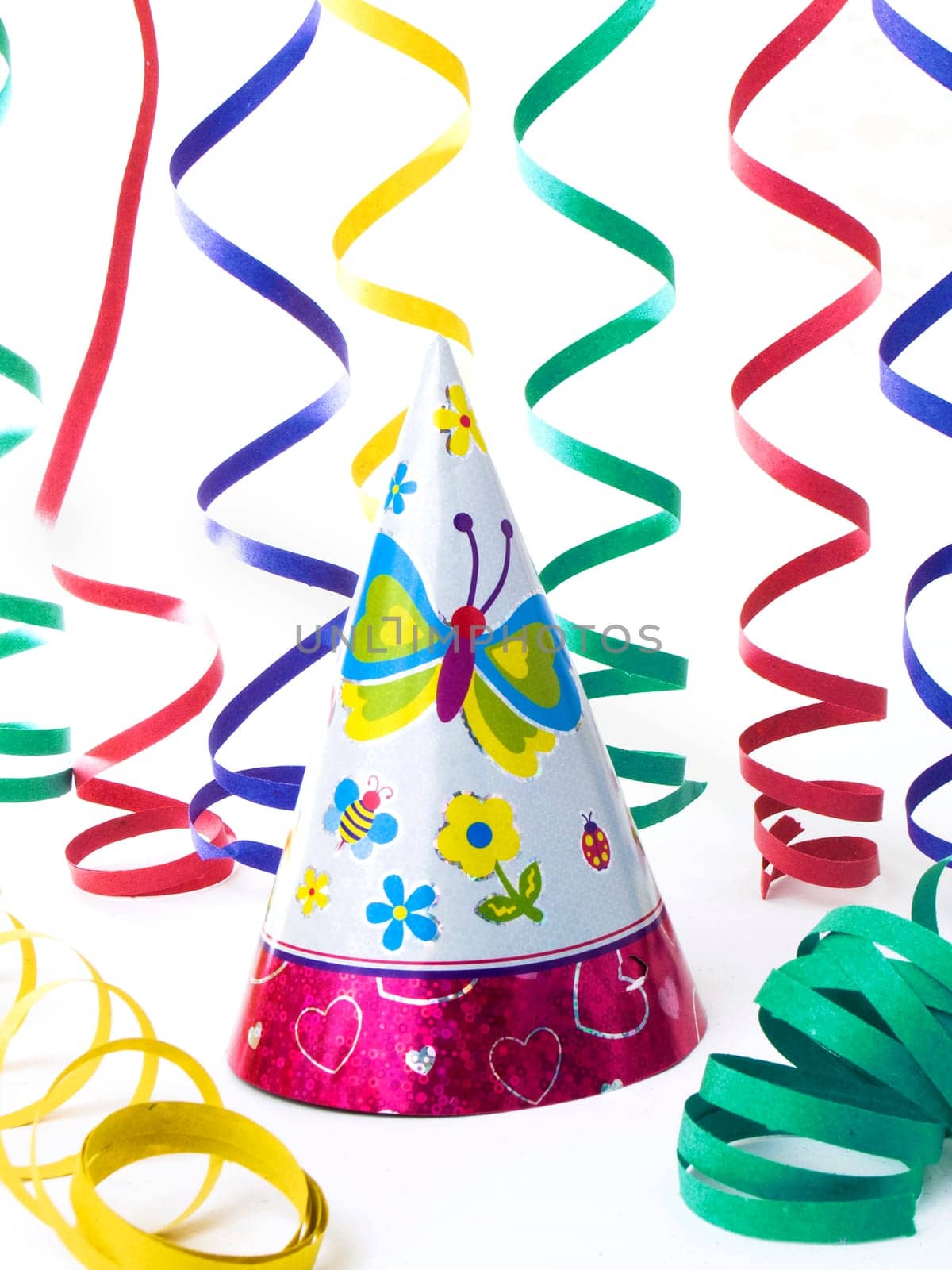 Hats and colorfull ribbons for kid's party, isolated on white background