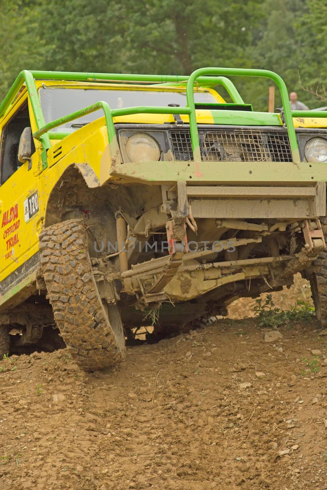 MOHELNICE, CZECH REPUBLIC - JUNE 10. Unidentified racer at yellow off-road car leaves steep slope in the "SHOCK CUP Trial 2012"" on June 10, 2012 in the town of Mohelnice, Czech Republic."