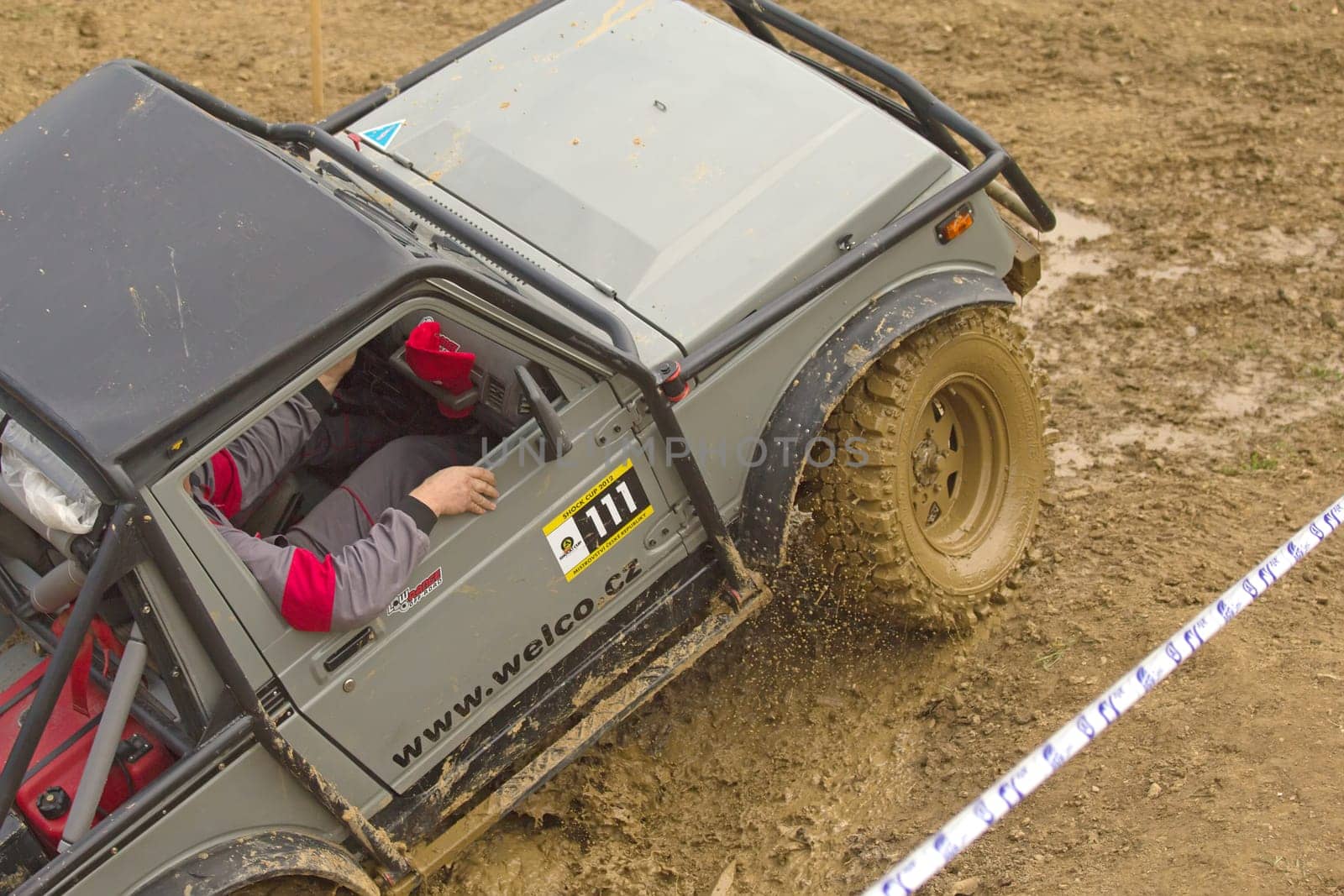 MOHELNICE, CZECH REPUBLIC - JUNE 10. Unidentified racer at off-road car leaves steep slope in the "SHOCK CUP Trial 2012"" on June 10, 2012 in the town of Mohelnice, Czech Republic."