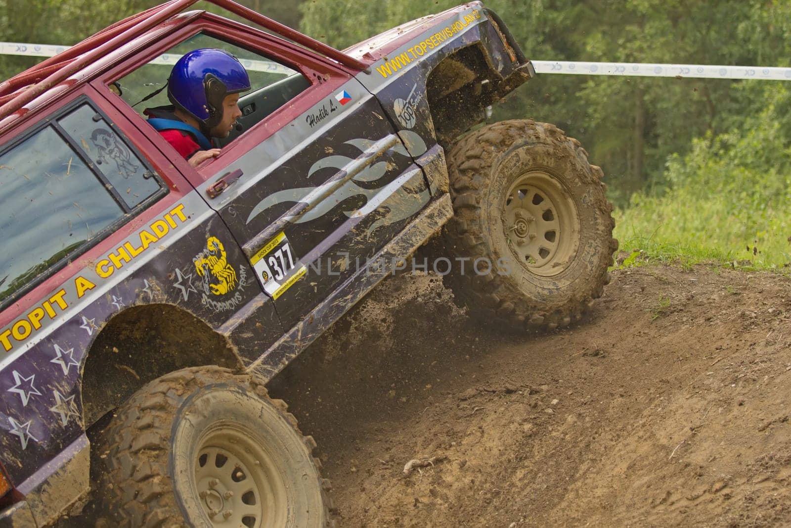 MOHELNICE, CZECH REPUBLIC - JUNE 10. Unidentified racer at off-road car leaves steep slope in the "SHOCK CUP Trial 2012"" on June 10, 2012 in the town of Mohelnice, Czech Republic."