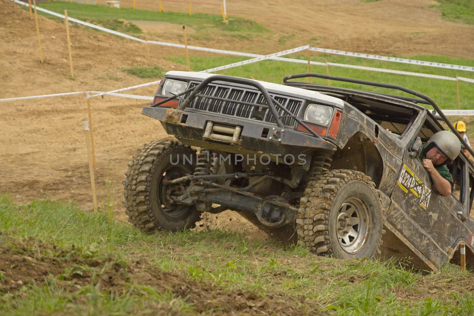 MOHELNICE, CZECH REPUBLIC - JUNE 10. Unidentified racer at off-road car leaves steep slope in the "SHOCK CUP Trial 2012"" on June 10, 2012 in the town of Mohelnice, Czech Republic."