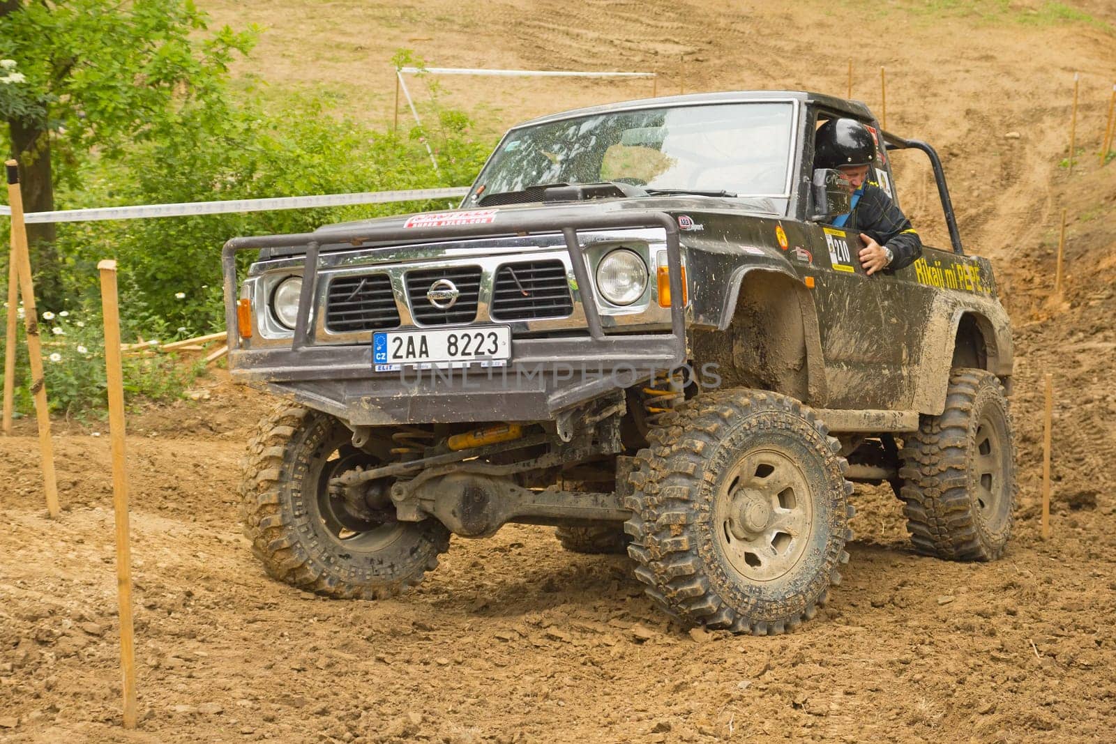 MOHELNICE, CZECH REPUBLIC - JUNE 10. Unidentified racer at off-road car in difficult muddy terrain in the "SHOCK CUP Trial 2012"" on June 10, 2012 in the town of Mohelnice, Czech Republic."