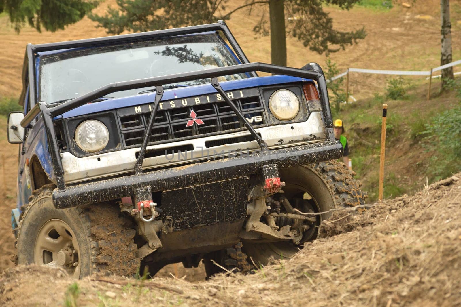 MOHELNICE, CZECH REPUBLIC - JUNE 10. Unidentified racer at off-road car leaves steep slope in the "SHOCK CUP Trial 2012"" on June 10, 2012 in the town of Mohelnice, Czech Republic."