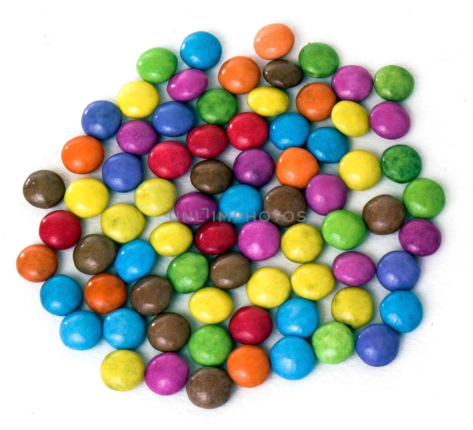 A lot of small sweets isolated on white background