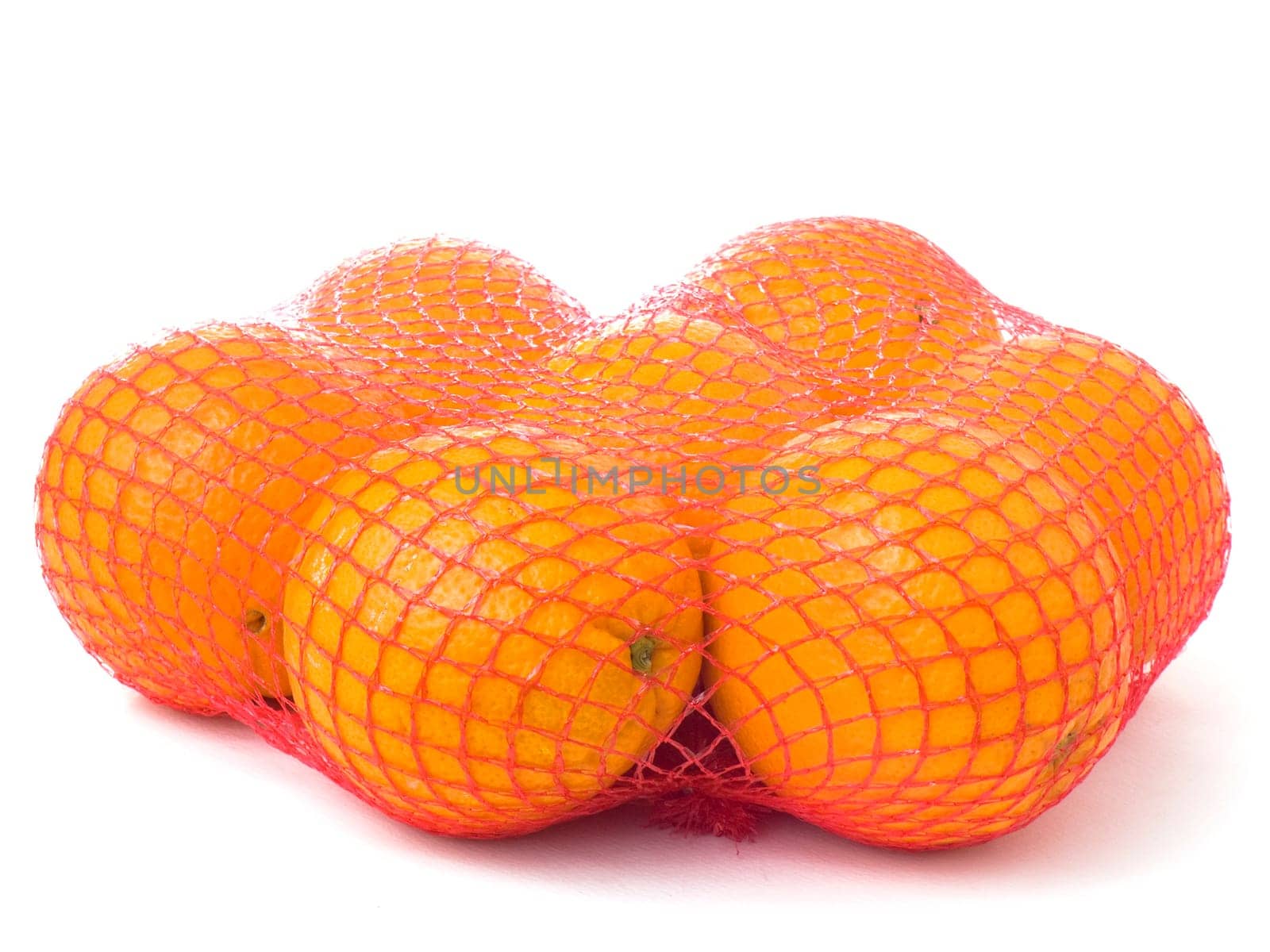 Seven oranges in a red net isolated on white background