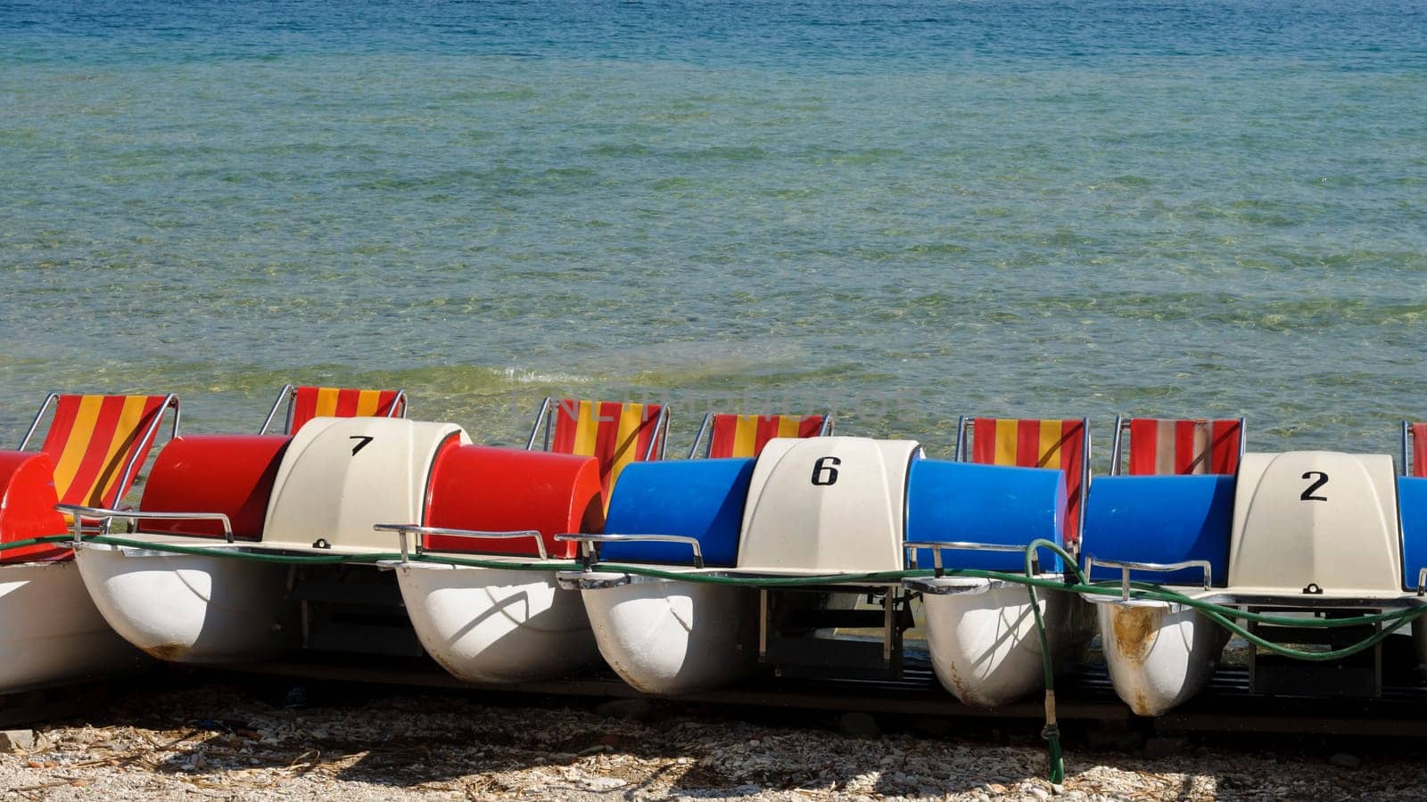Colorful pedal boats on the beach