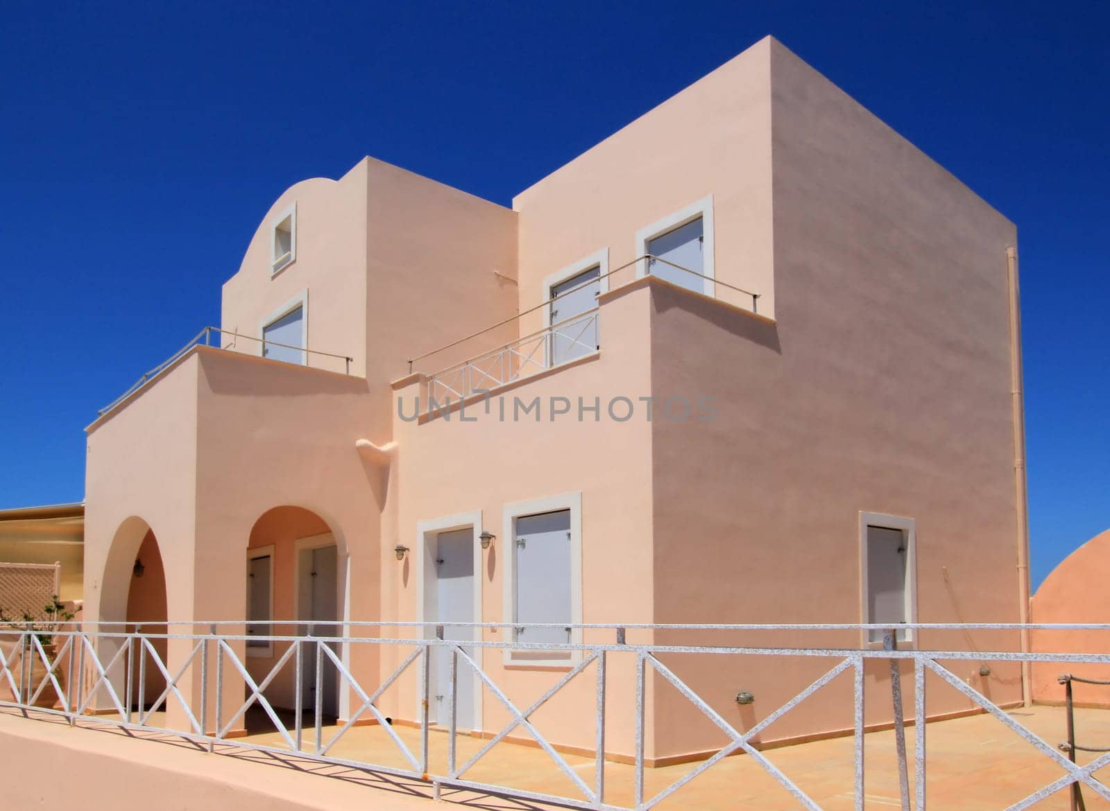 Big colorful house at Oia by beautiful weather, Santorini, Greece