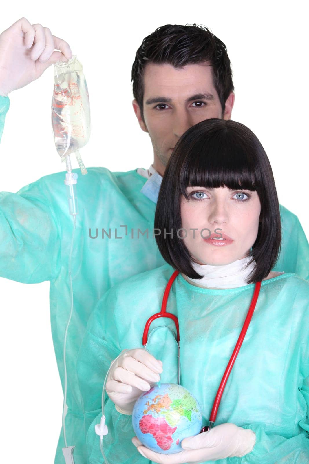 two surgeons auscultating a globe