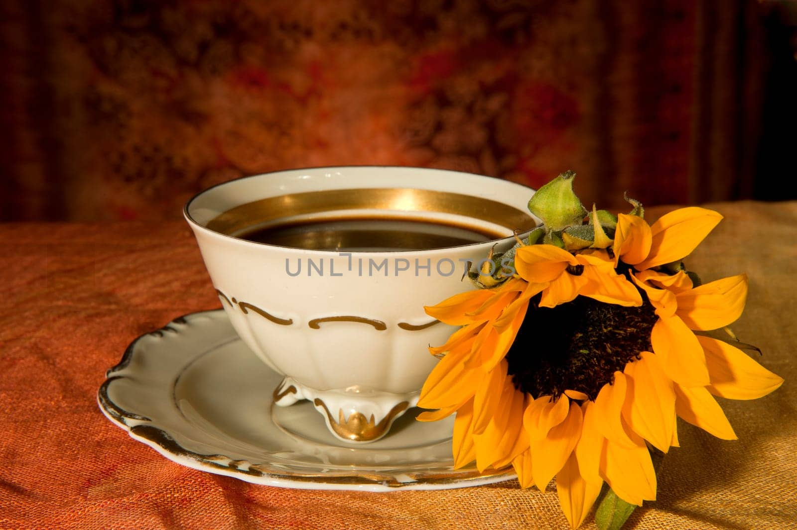 cup of coffee and sunflower colored background