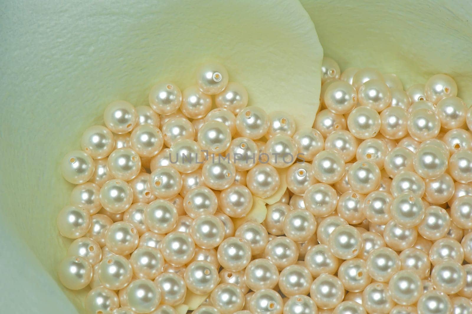 pearls scattered on a colored background fabric