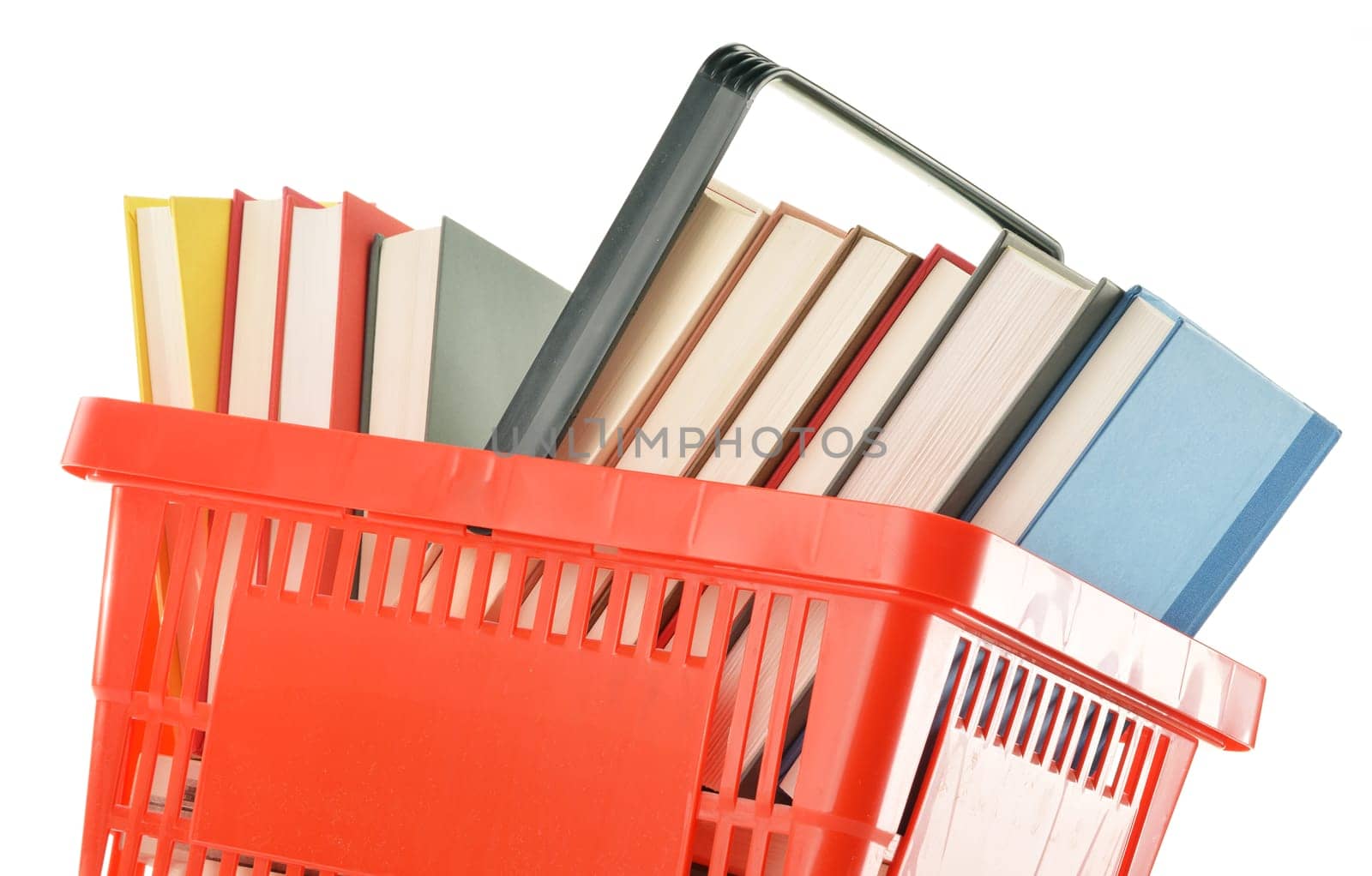 Plastic shopping basket with books isolated on white