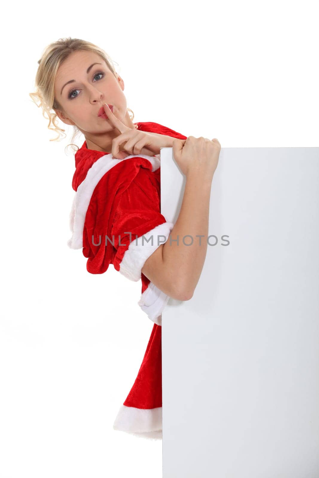 Woman with her finger on her lips
