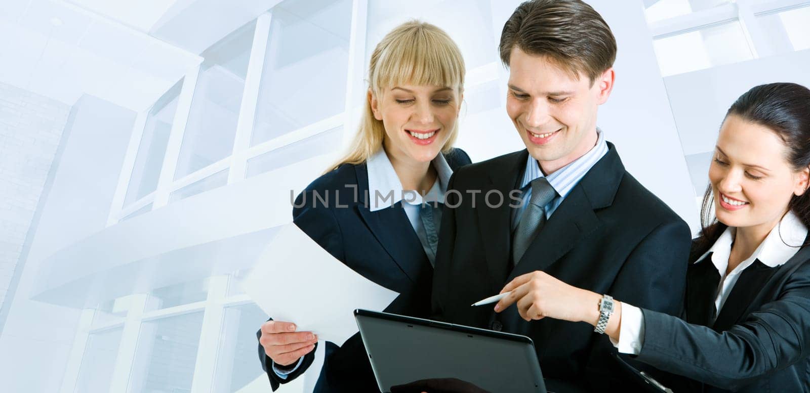 Confident business people interacting at meeting on the background of office building