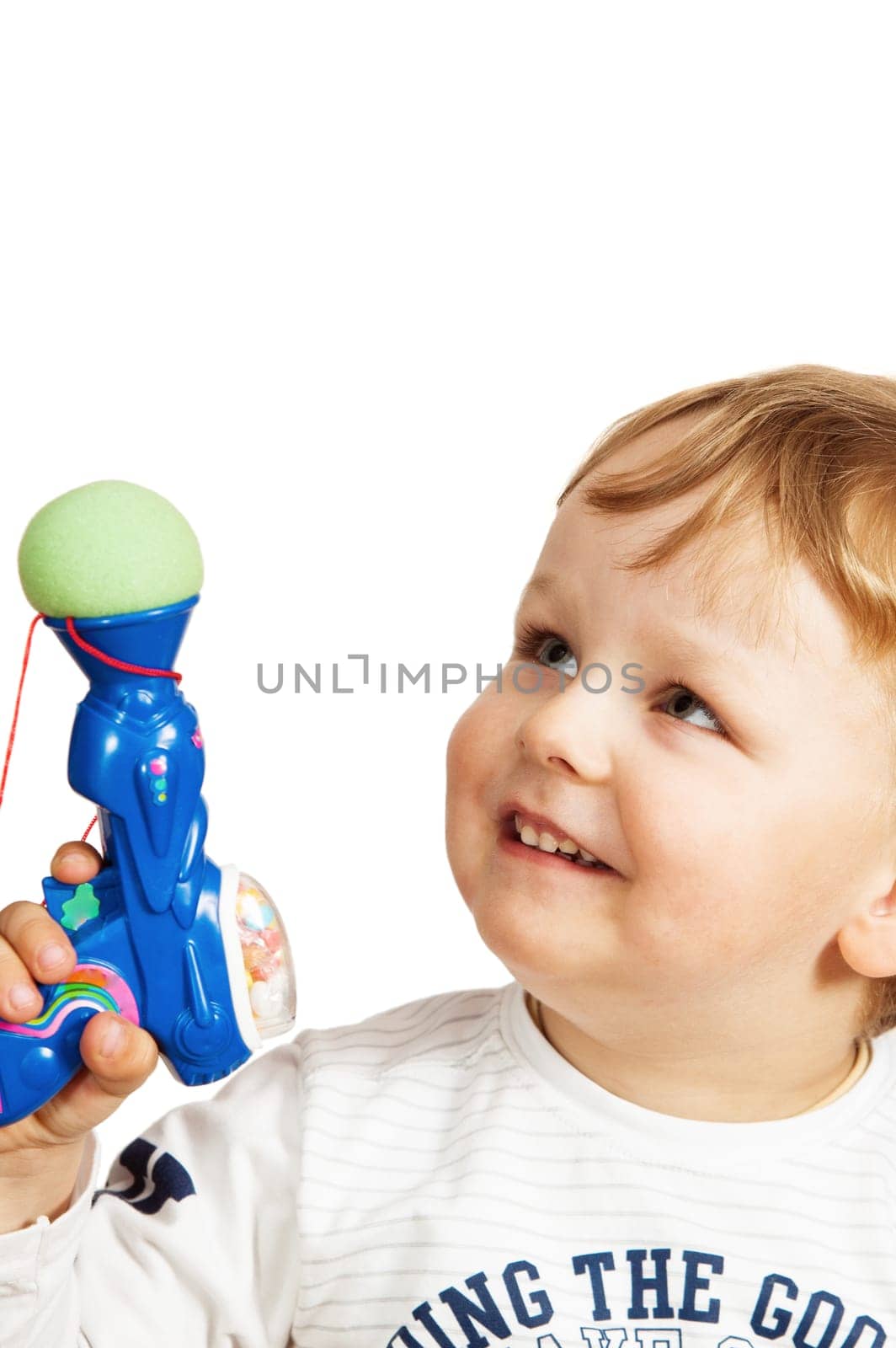 Portrait of the little boy with a toy pistol