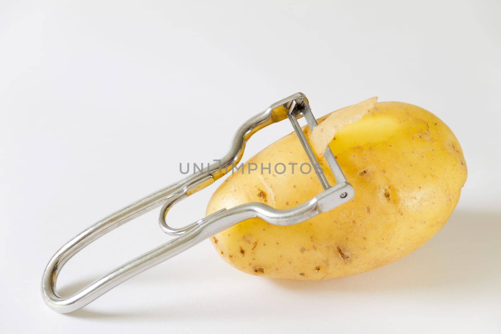 Potato with peeler