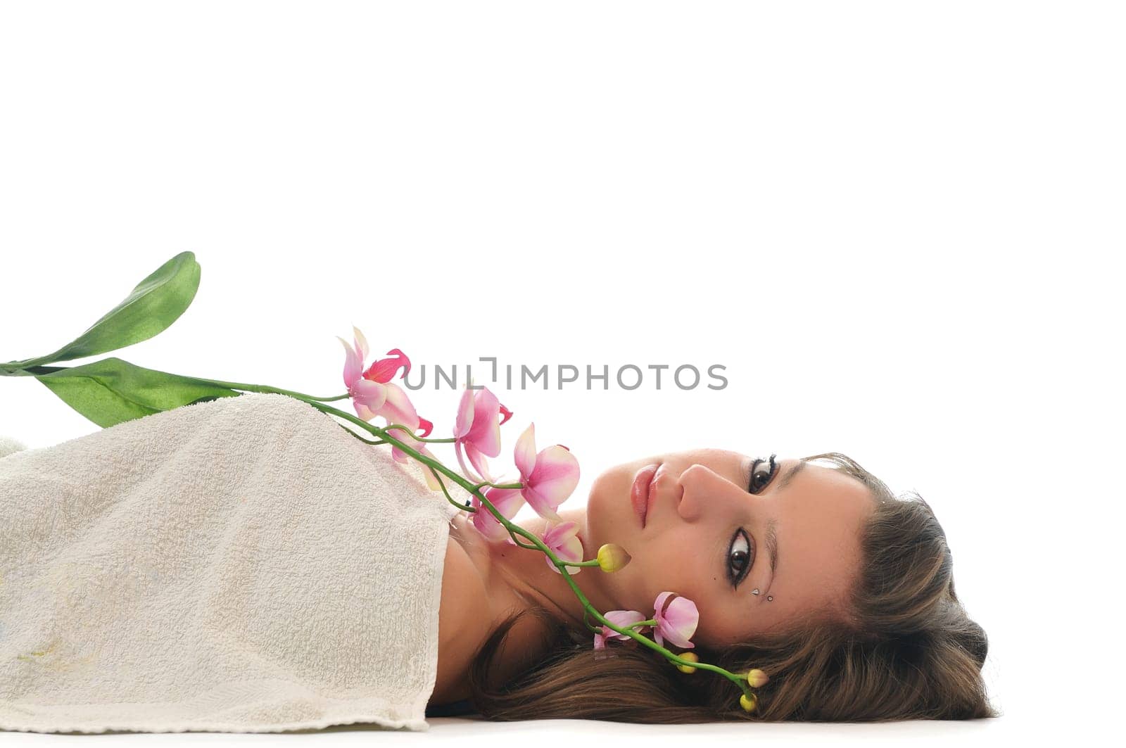 beauty halth and spa wellness isolated young woman face portrait closeup with towel and flower treatment