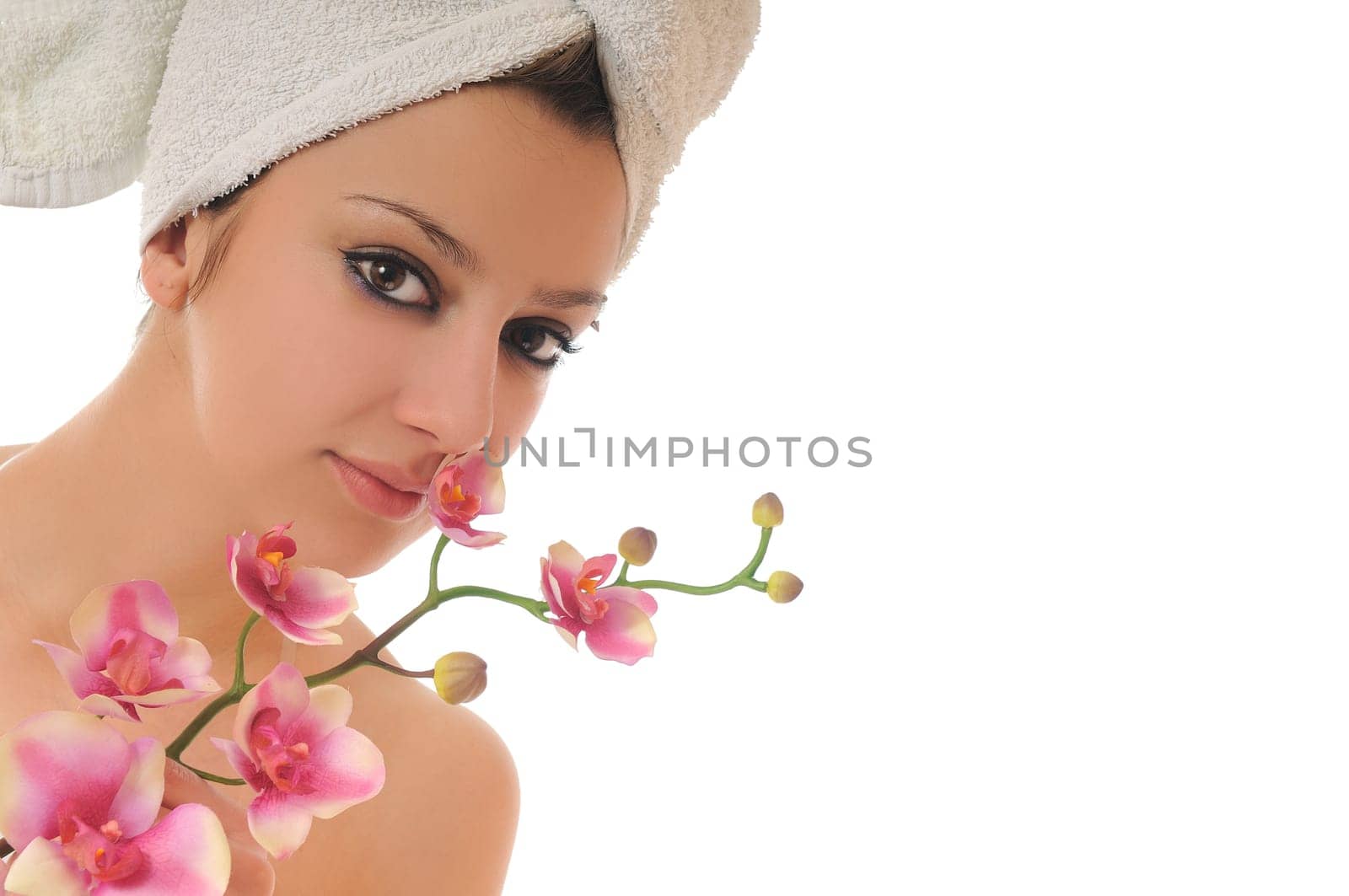 beauty halth and spa wellness isolated young woman face portrait closeup with towel and flower treatment