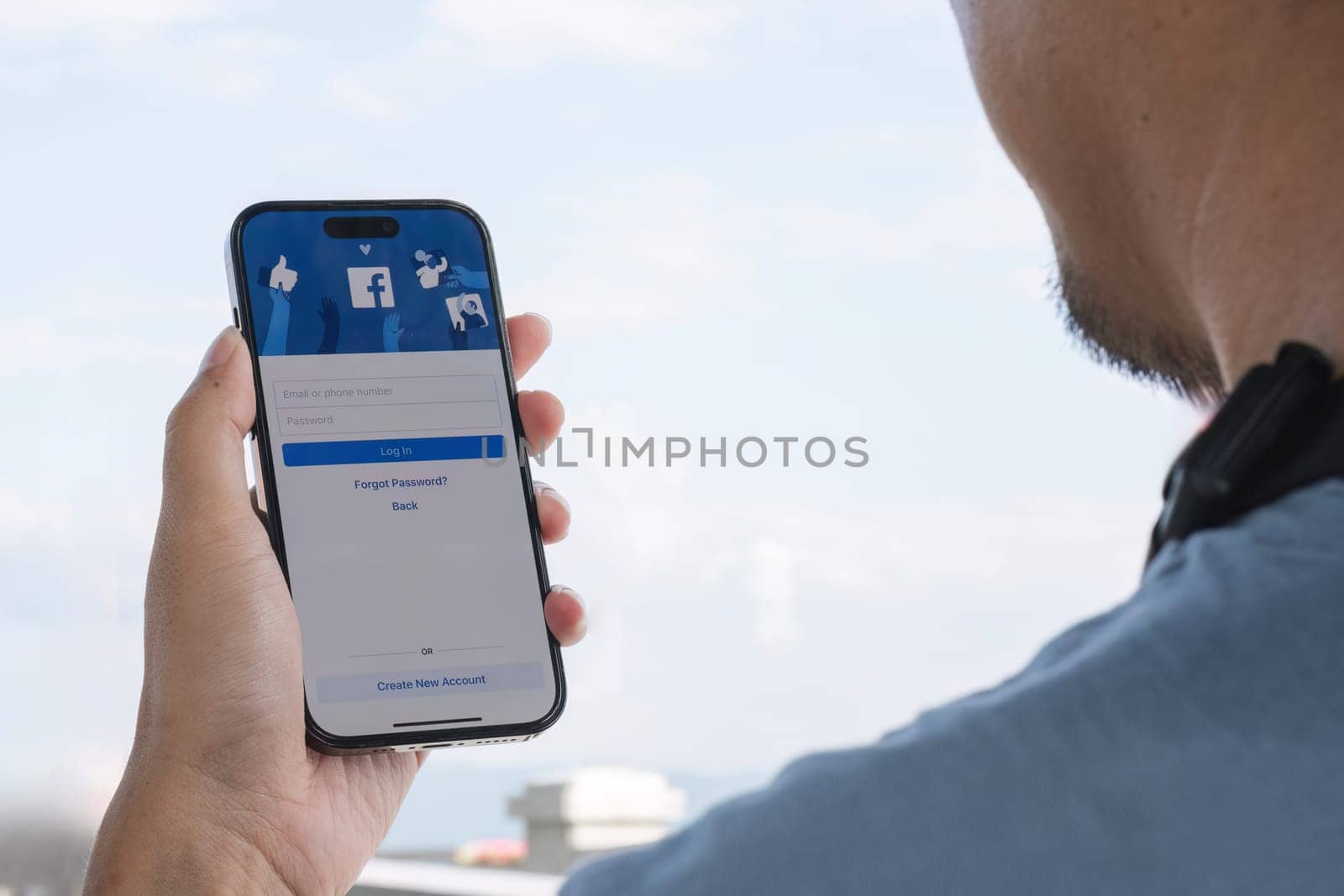 CHIANG MAI, THAILAND - OCT 25, 2023: Facebook social media app logo on log-in, sign-up registration page on mobile app screen on iPhone 14 in person's hand working on e-commerce shopping business.