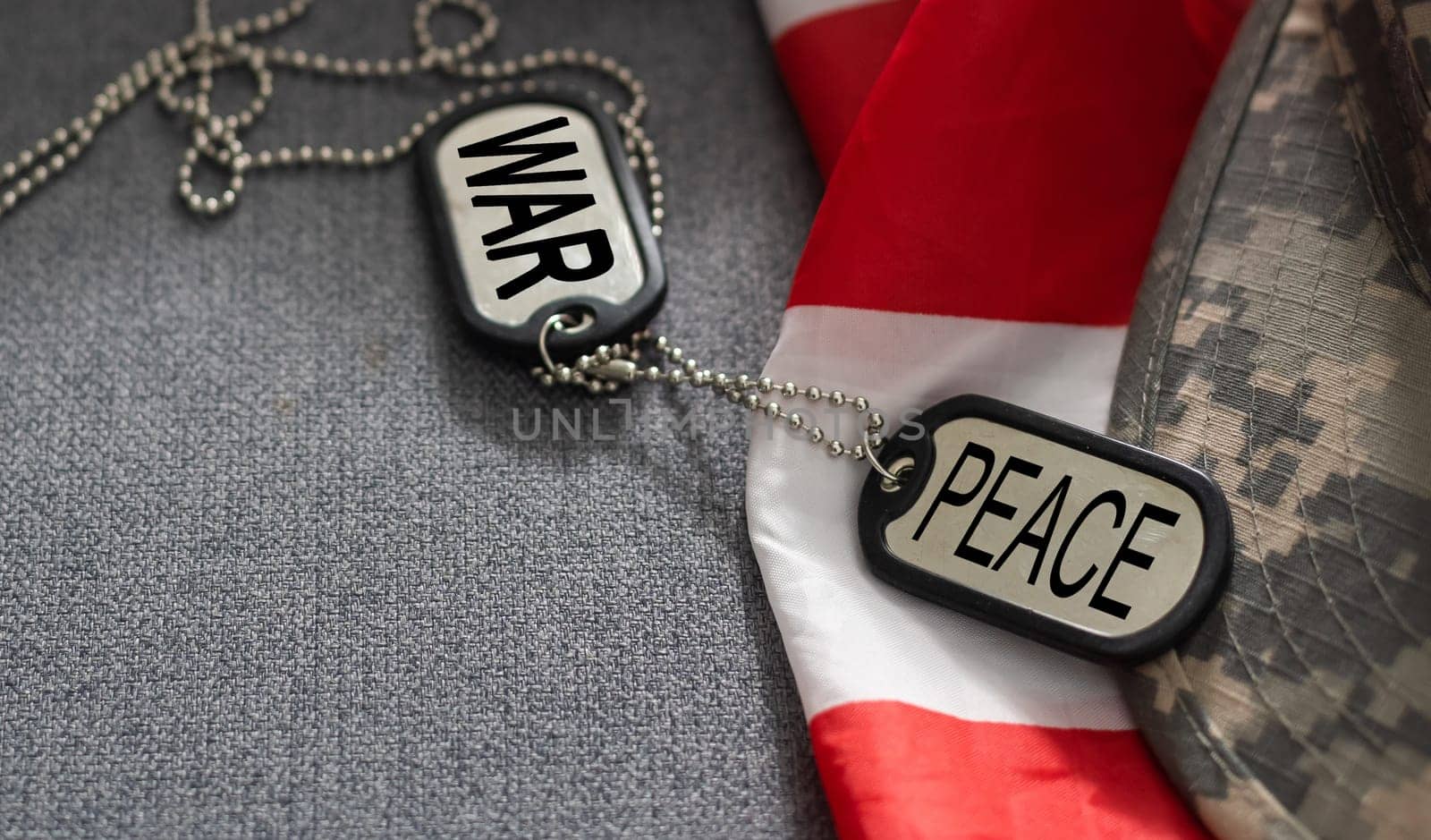 army blank, dog tag with text war peace on the khaki texture background. military concept. High quality photo