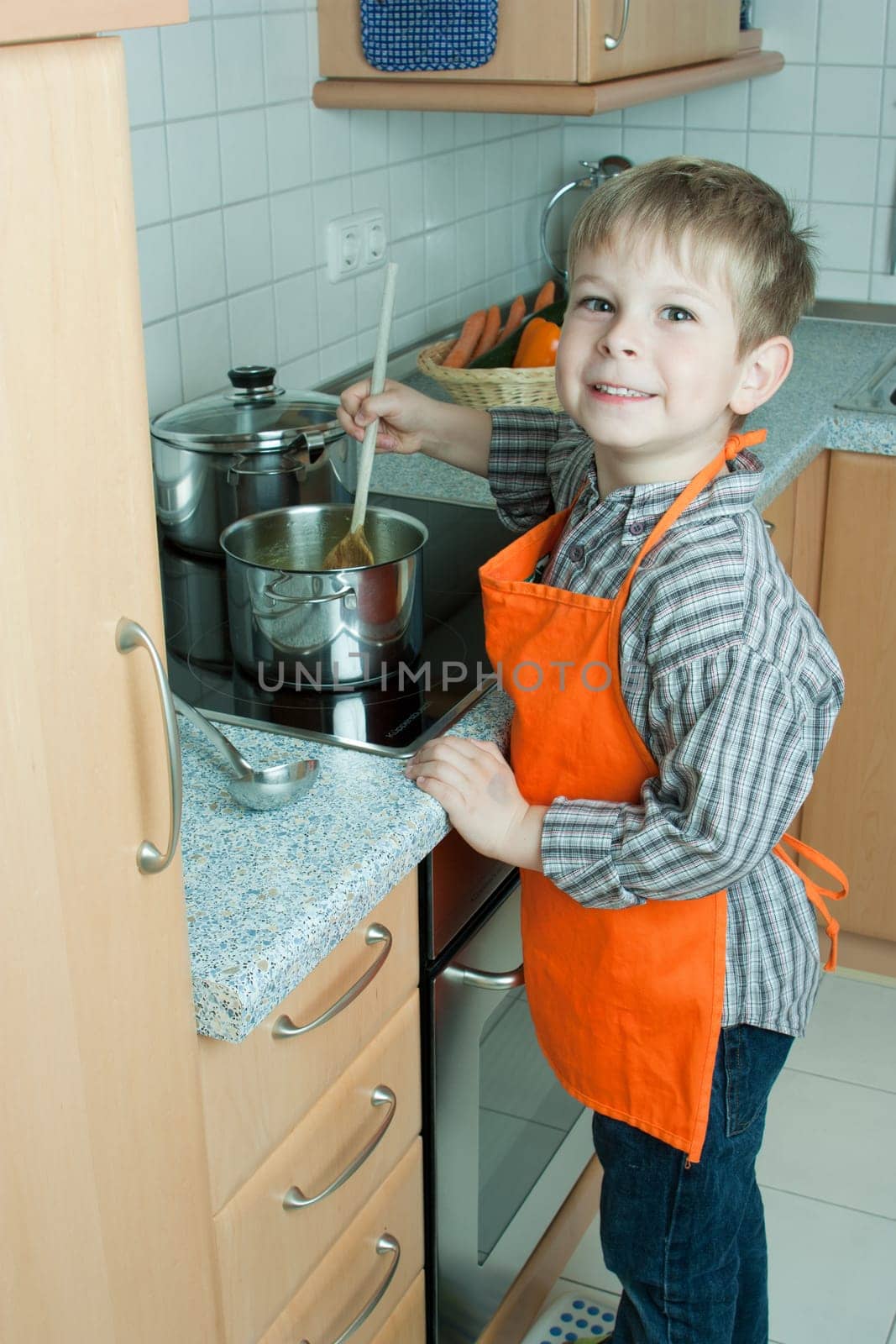 Boy cooking soup