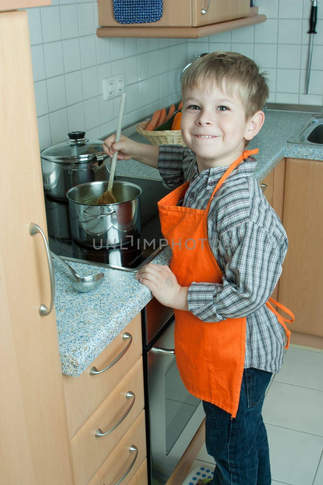 Boy cooking soup