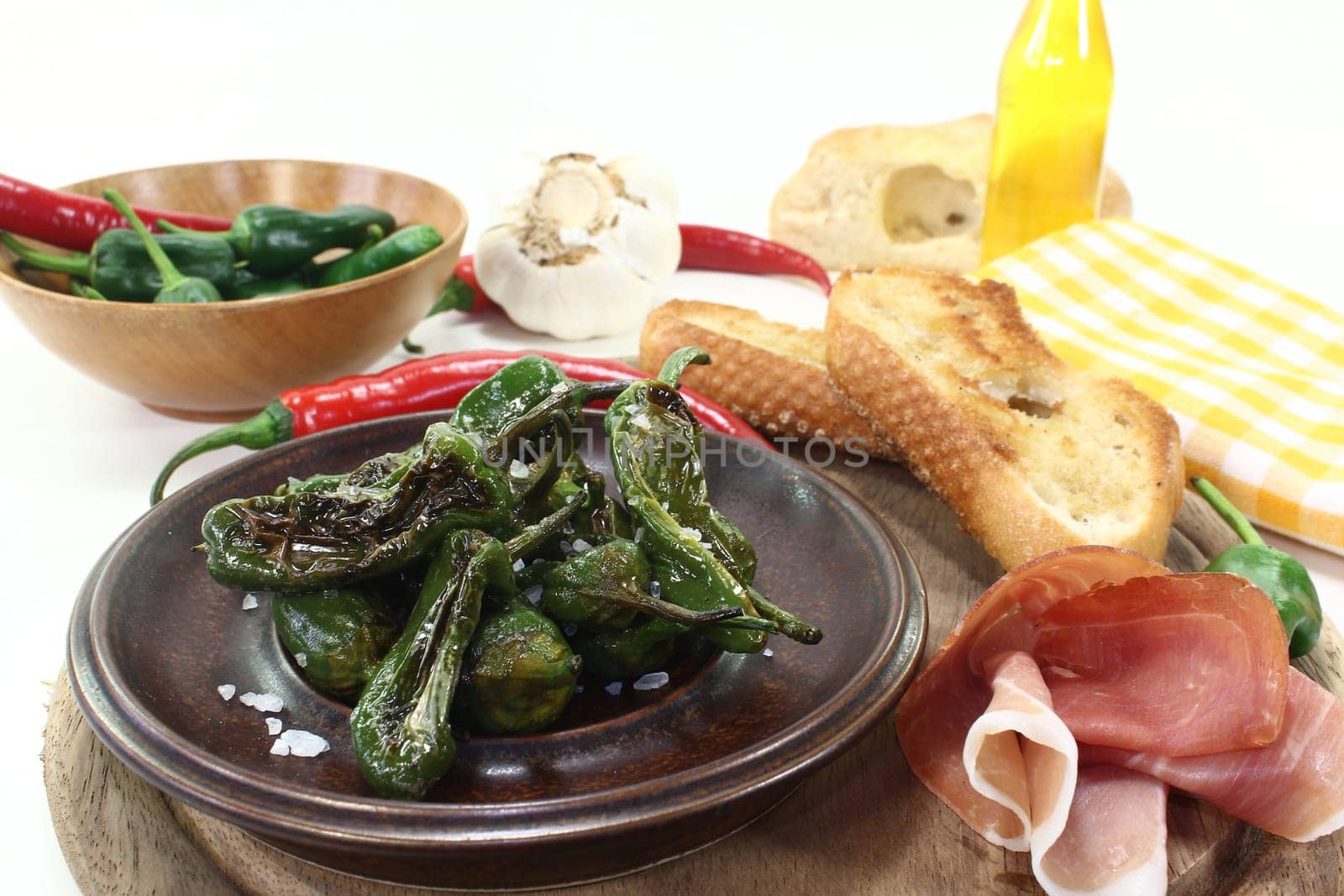 fried pimentos with ham and baguette