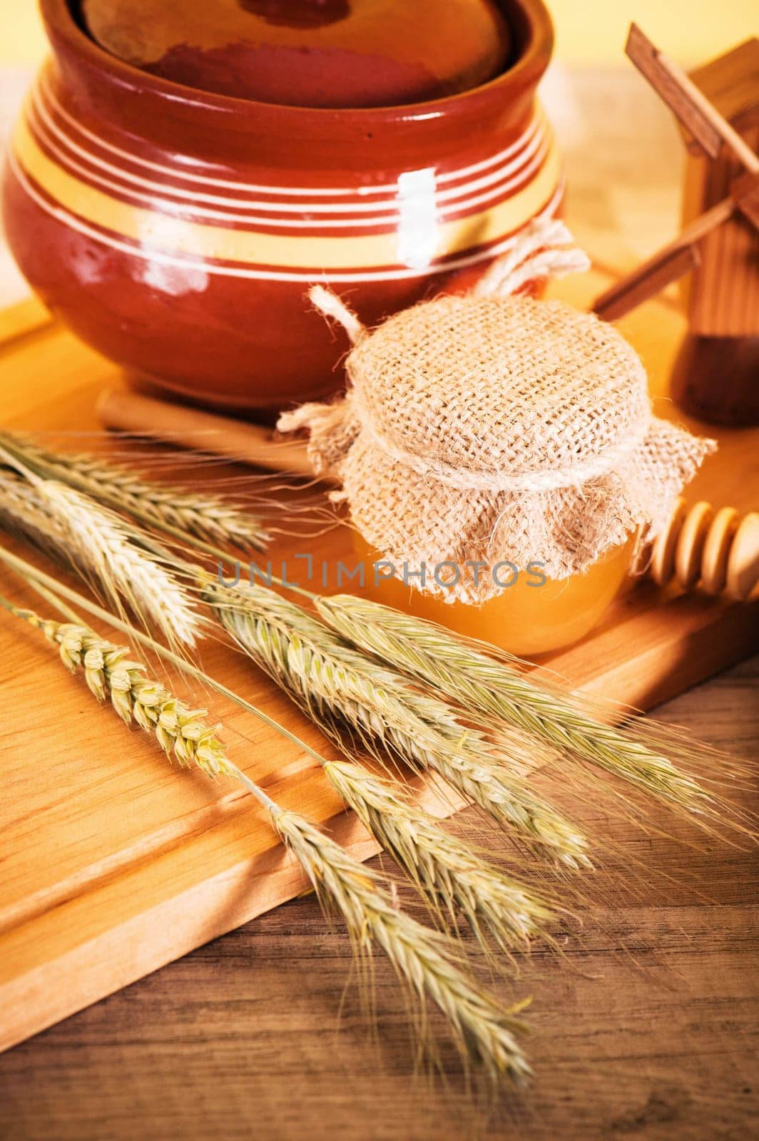 sliced bread and wheat on the wooden table
