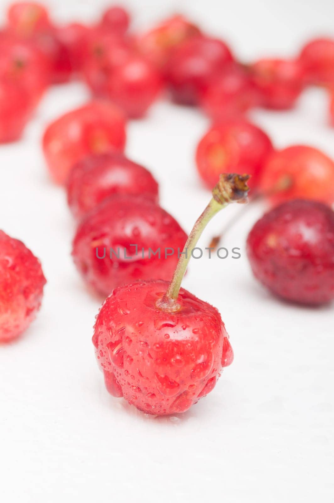 Fresh Red Cherries on White Wooden Table