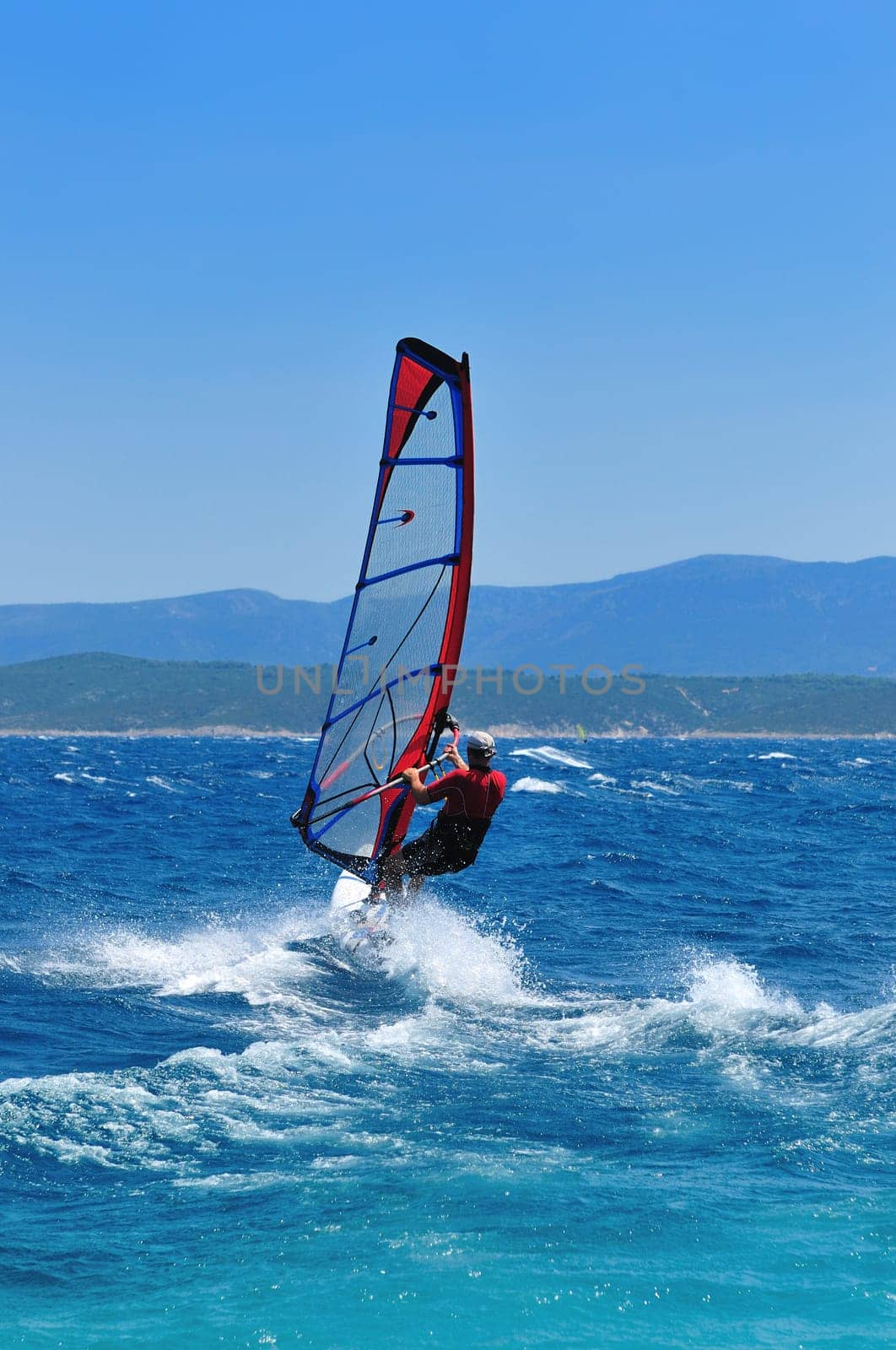 man wind sirfing and have healthy lifestyle