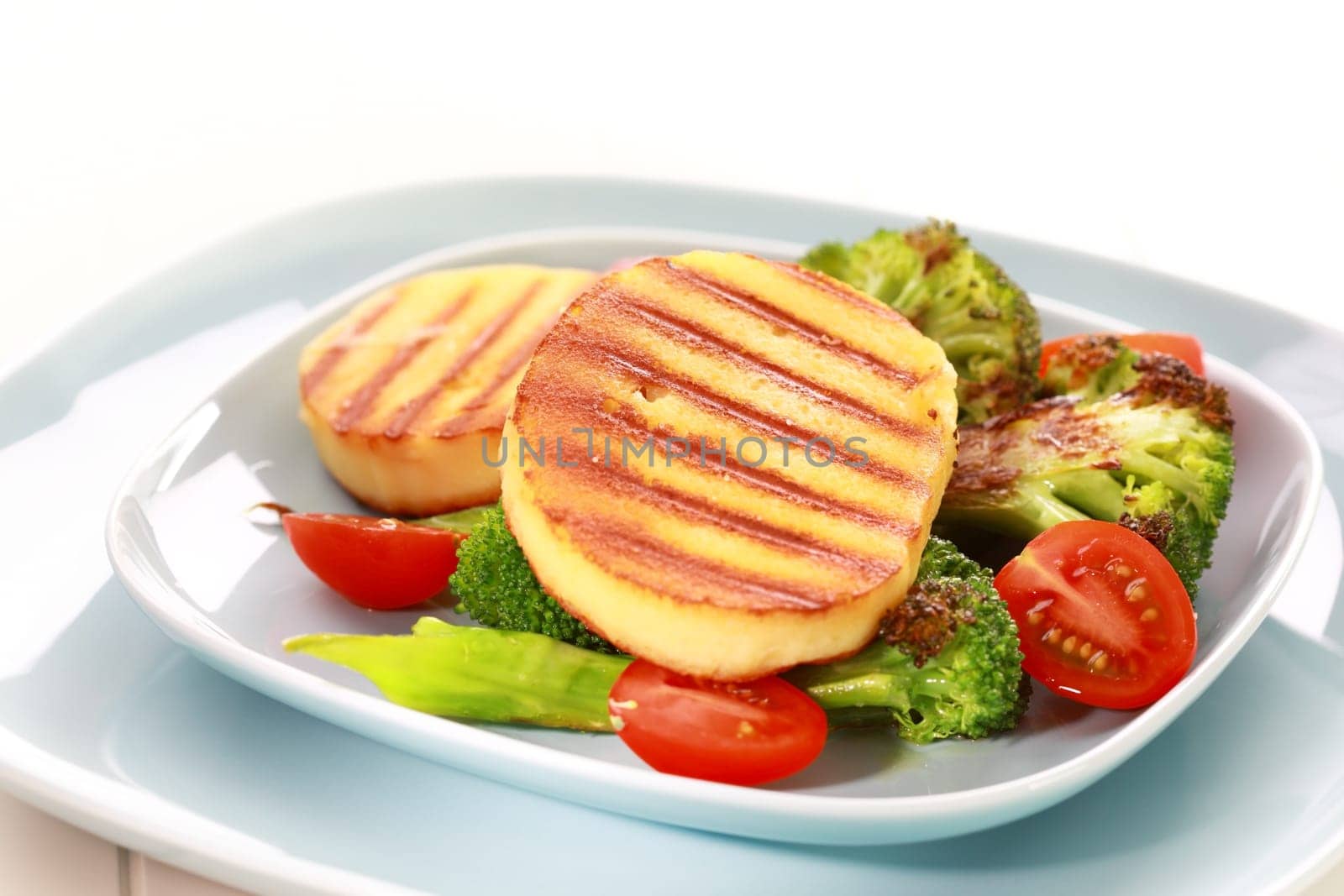 Grilled gouda cheese on grilled vegetables