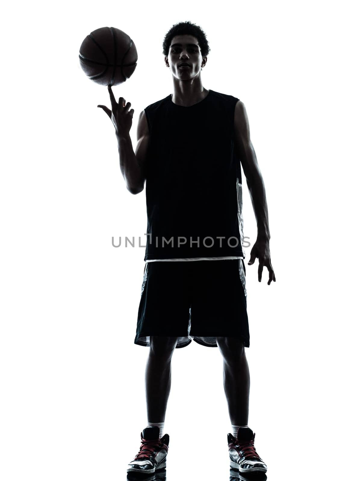one young man basketball player silhouette in studio isolated on white background