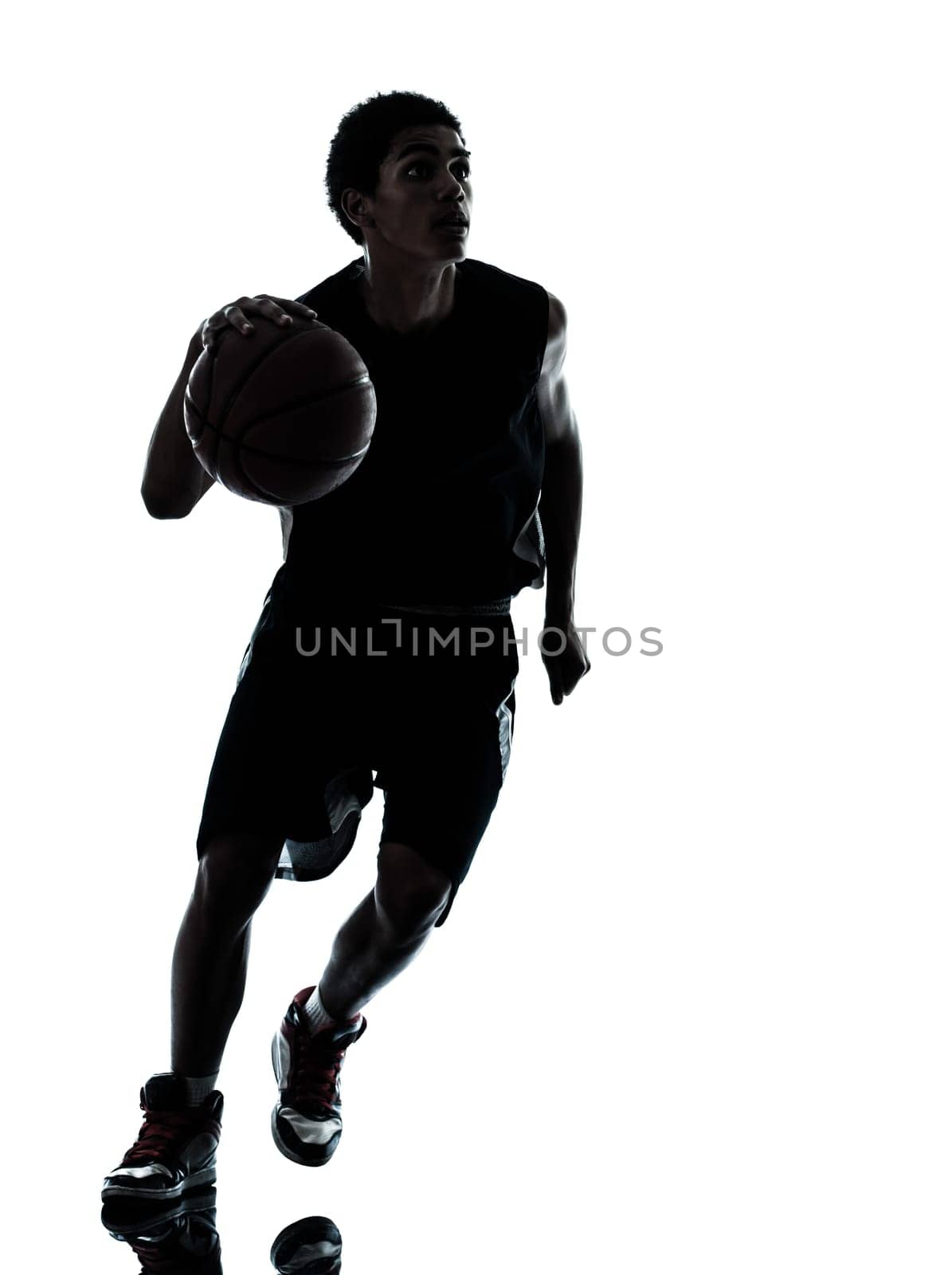 one young man basketball player silhouette in studio isolated on white background