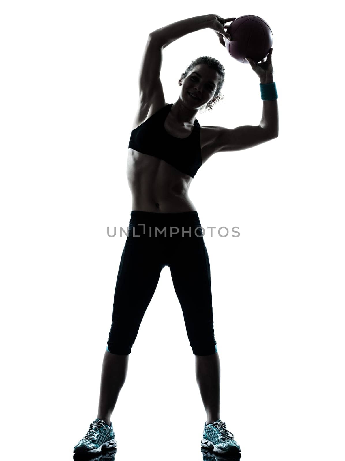 one caucasian woman exercising fitness ball workout posture in silhouette studio isolated on white background
