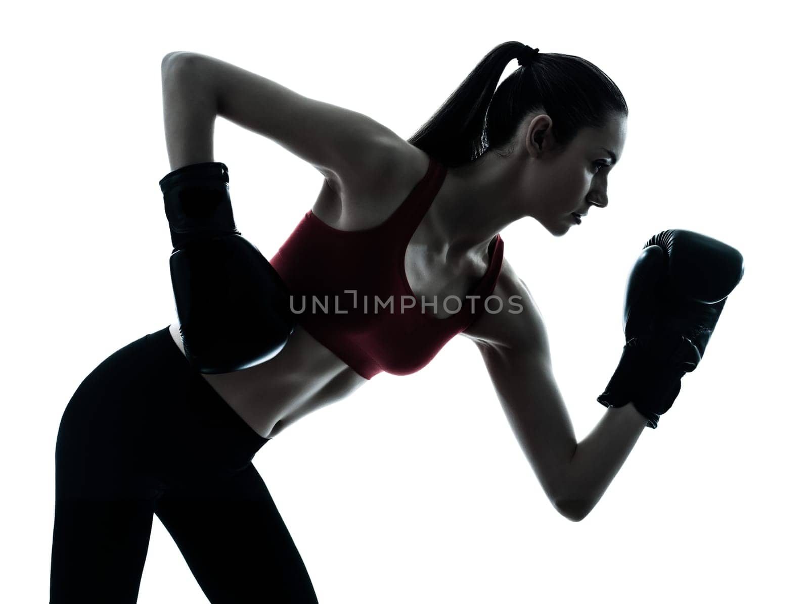 one caucasian woman boxing exercising in silhouette studio  isolated on white background