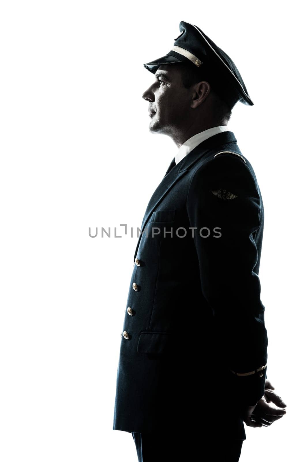 one caucasian man in airline pilot uniform silhouette in studio isolated on white background