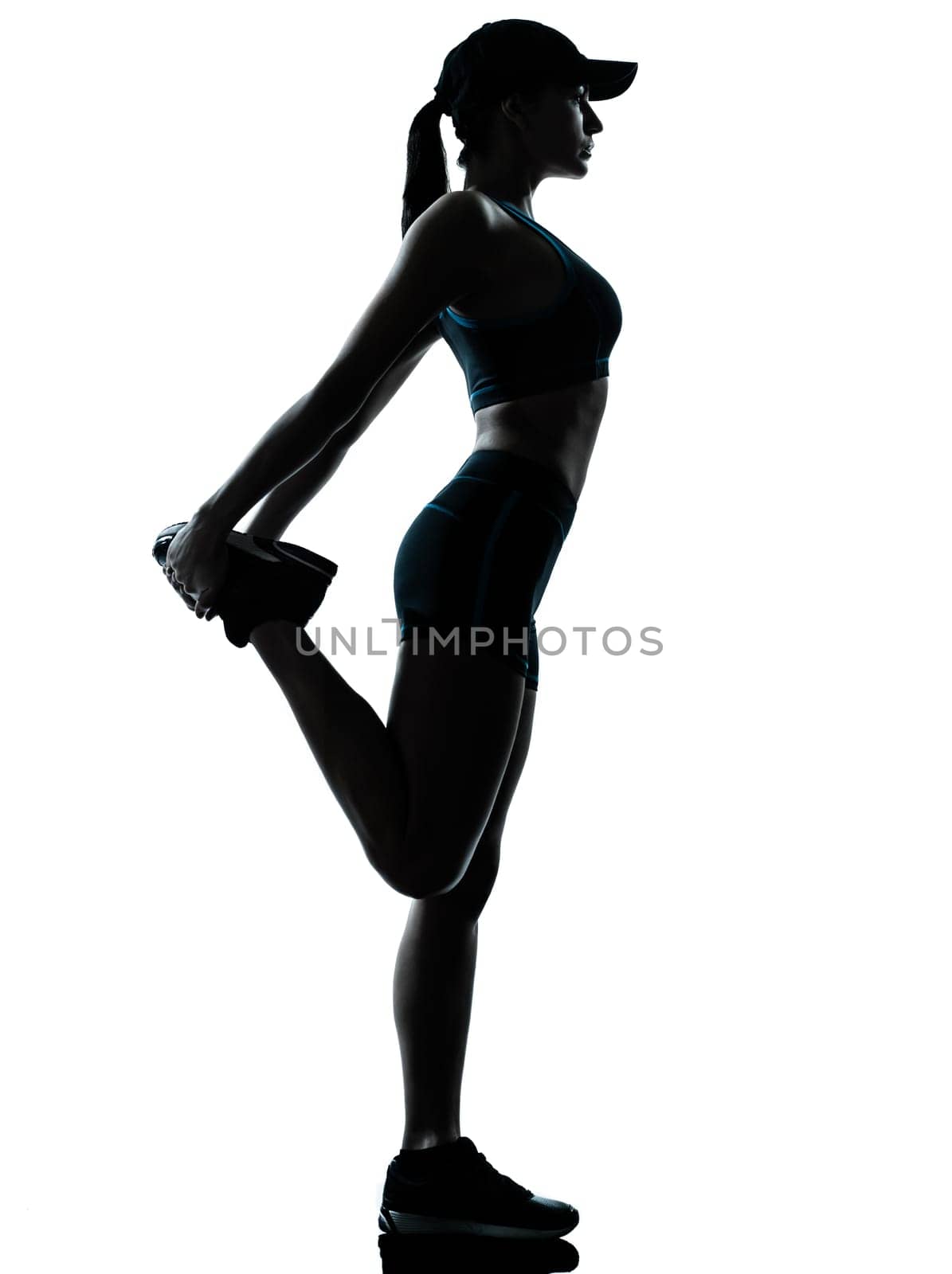 one caucasian woman runner jogger stretching legs in silhouette studio isolated on white background