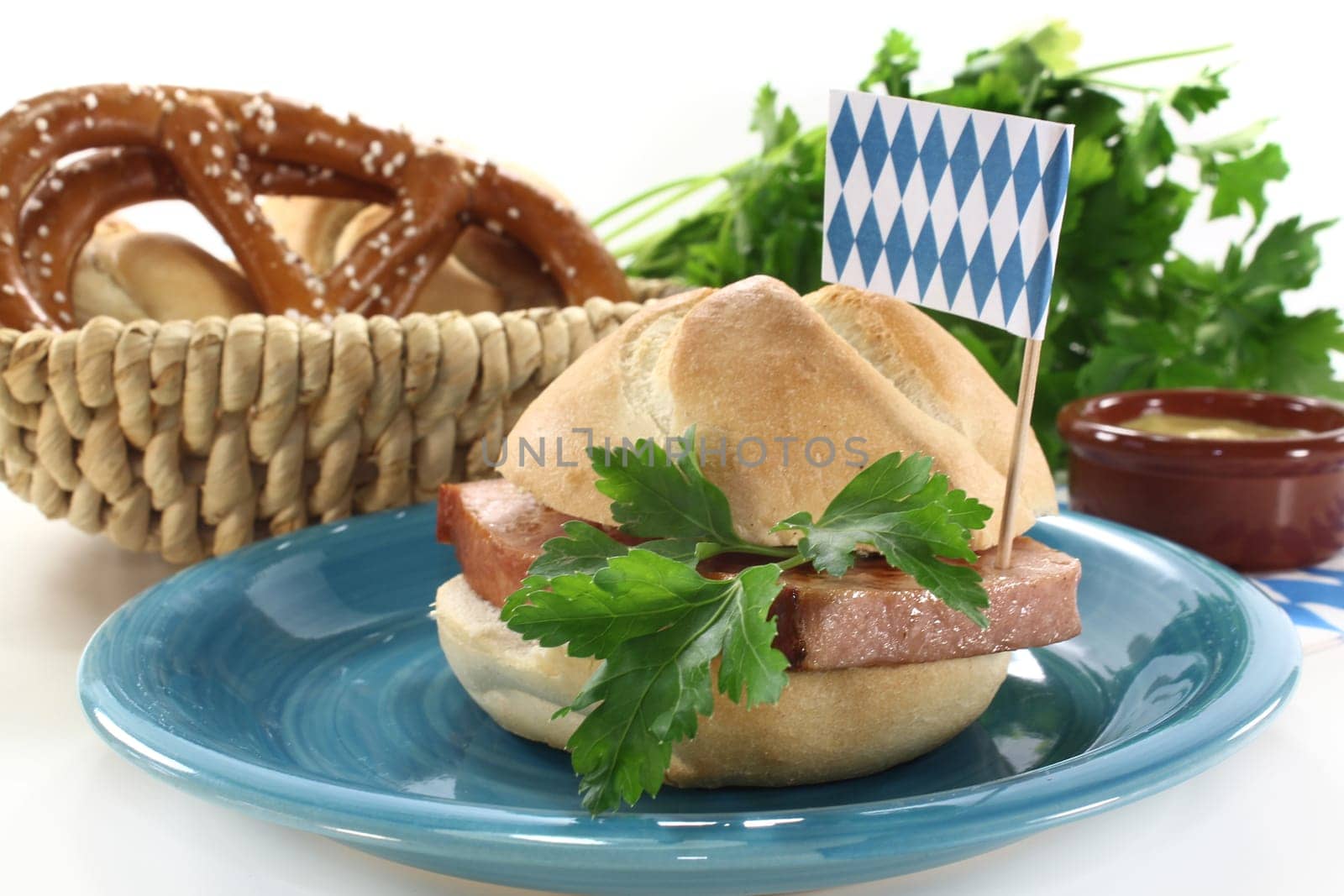 a roll with meatloaf and parsley