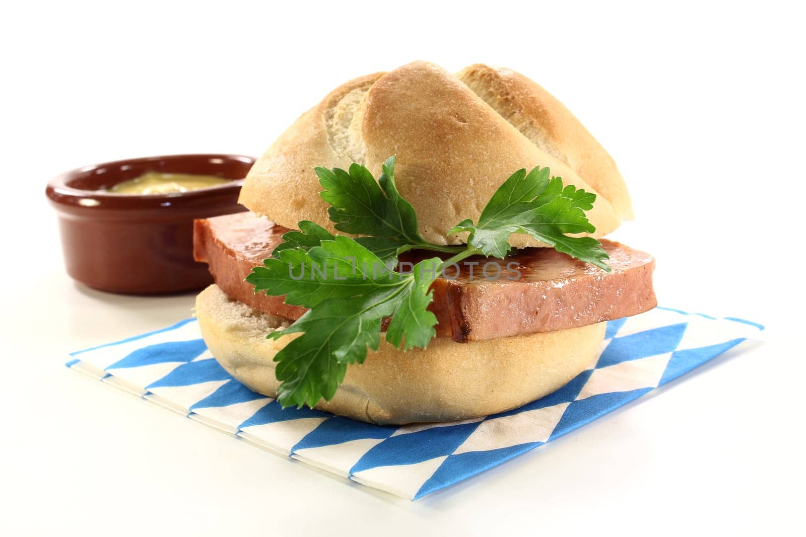 a roll with meatloaf and parsley