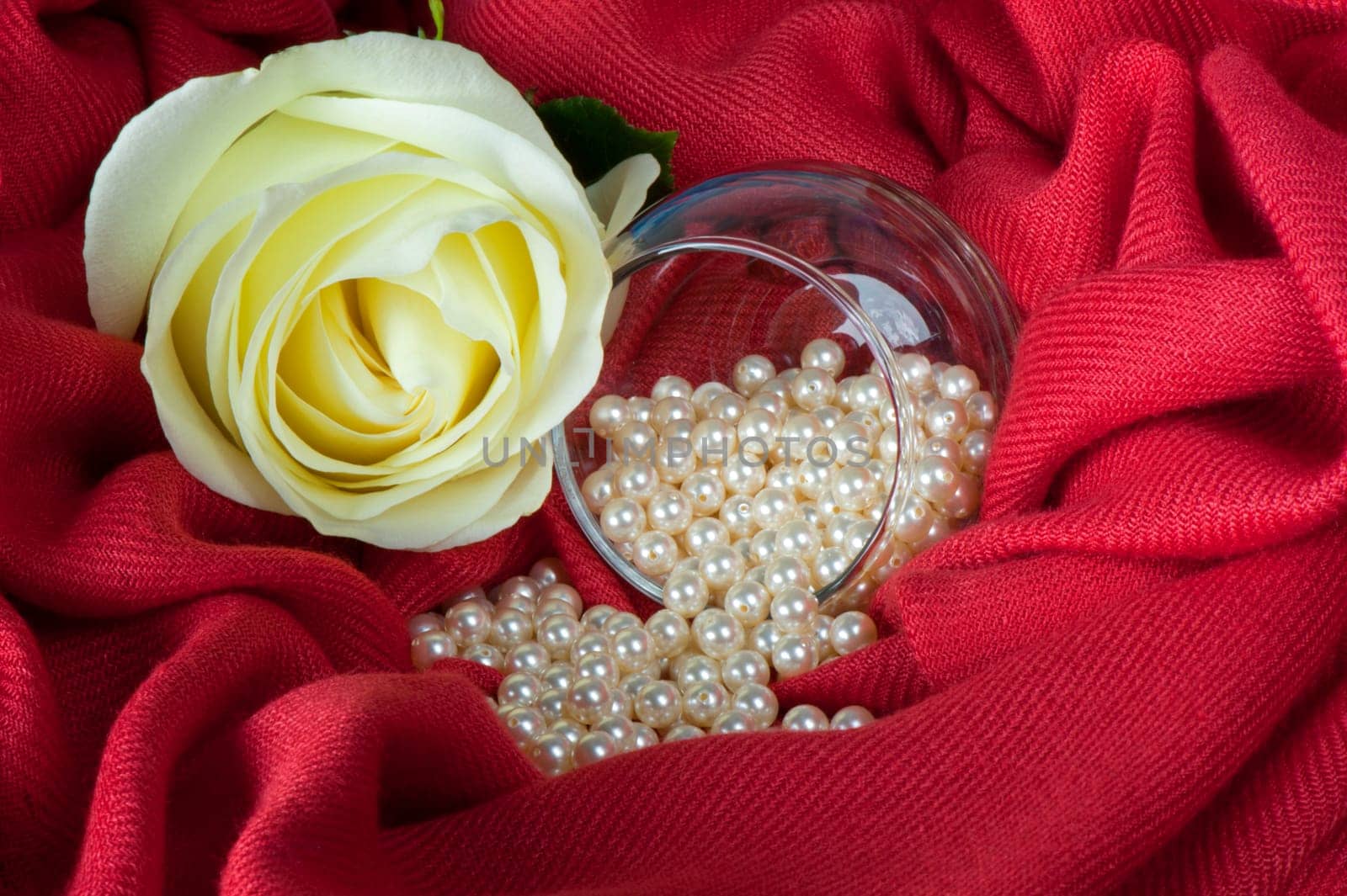pearls scattered on a colored background fabric