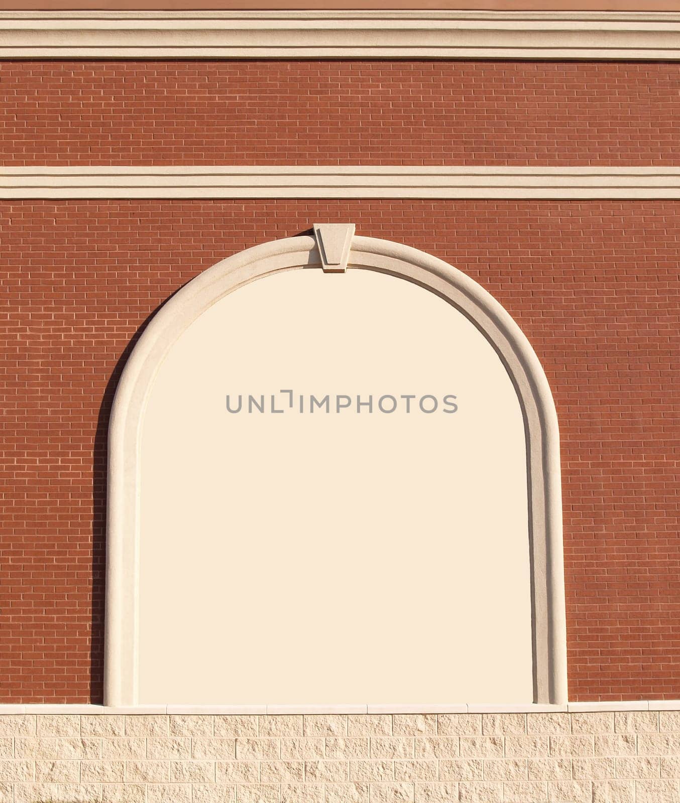 Ornate Roman styled brick wall with curved molding and copy space.