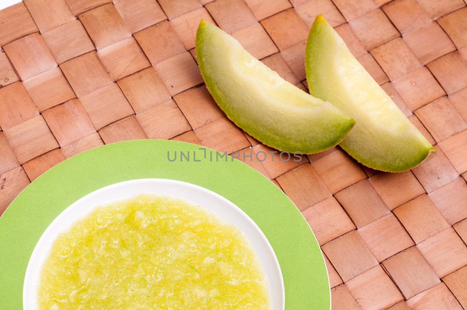 Galia melon and cold soup in a plate